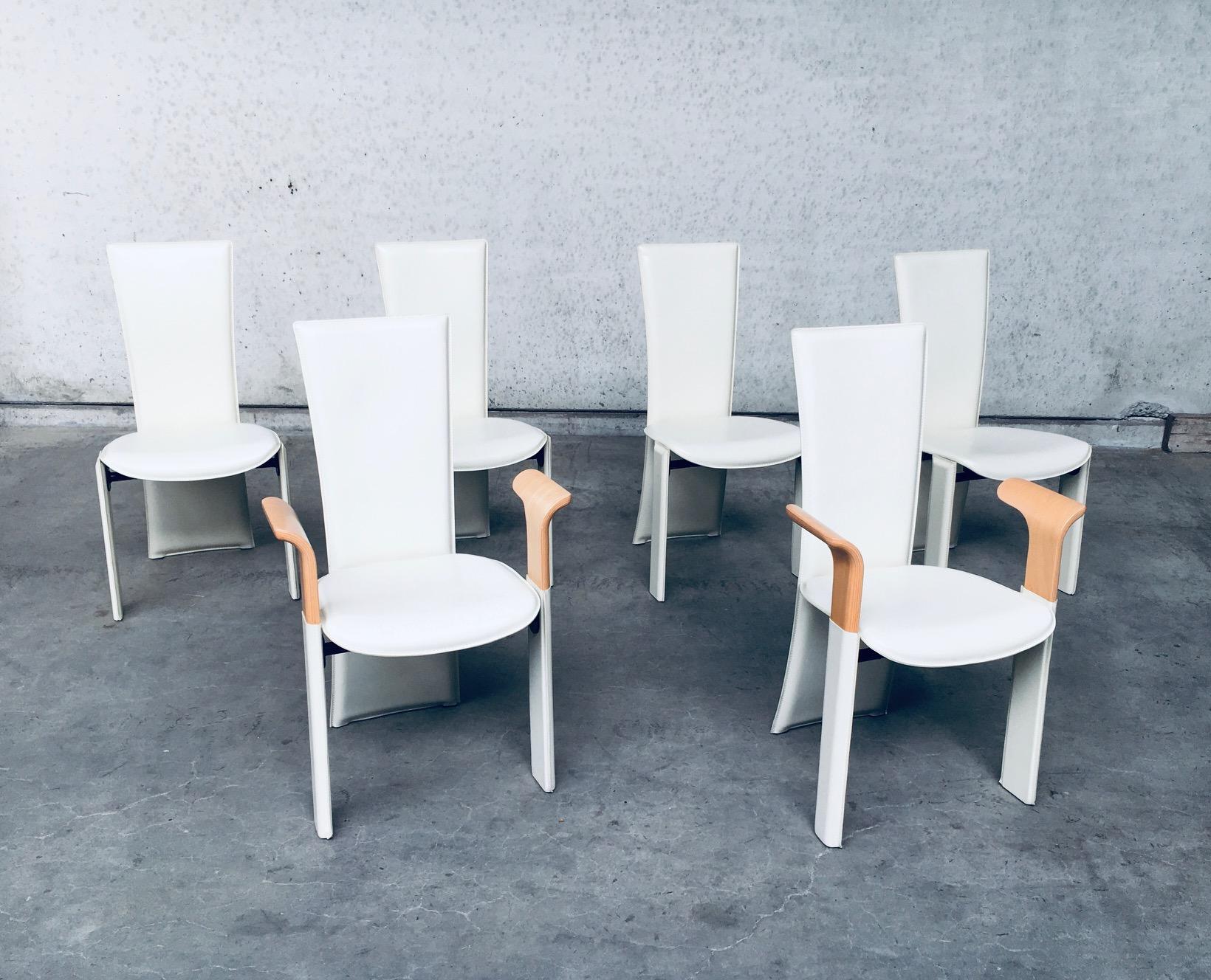 Vintage Postmodern Italian Design Dining chair set of 6 by Pietro Costantini, made in Italy in the 1980's. All leather covered high back beige dining chairs. Set comprises of 4 chairs without armrests and 2 with beech wooden armrests. Marked on the