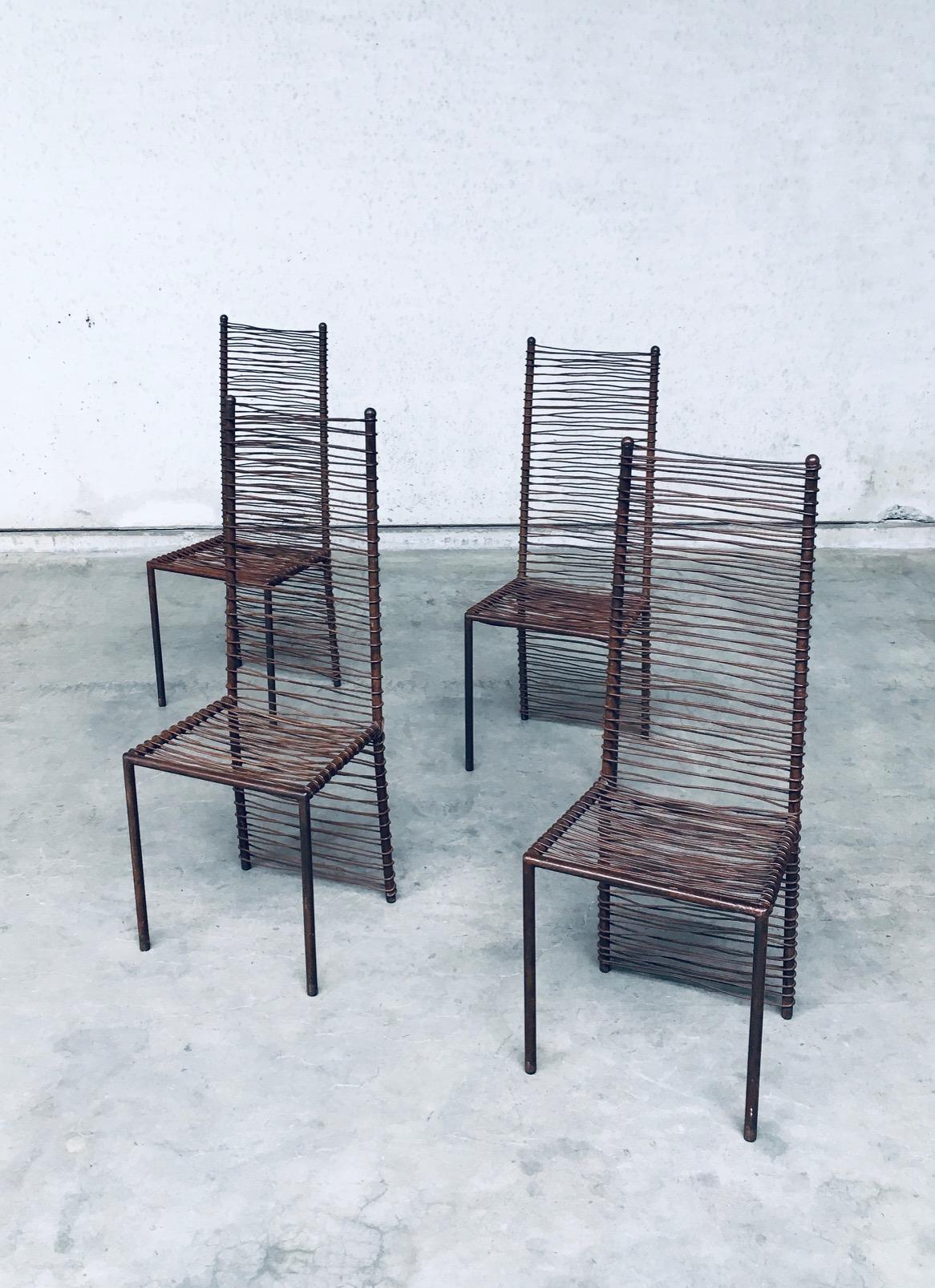 Vintage Postmodern Design One of a Kind Handcrafted Iron High Back Chair set of 4, made in the 1980's. All iron constructed handmade chairs. High back model with welded wrapped wire on back and seat. Iron has been controlled patinated and treated.