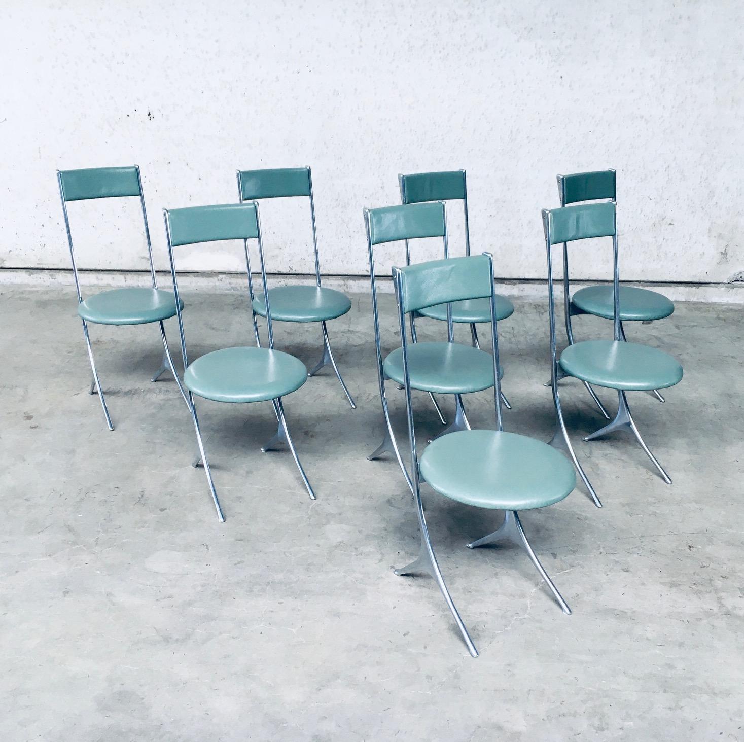 Vintage original Postmodern Design set of 8 Dining Chairs in marine green leather by Zanotta, made in Italy circa 1985. This turqoise marine green leather dining chair has a formed aluminium metal frame in classic Philippe Starck style. In near
