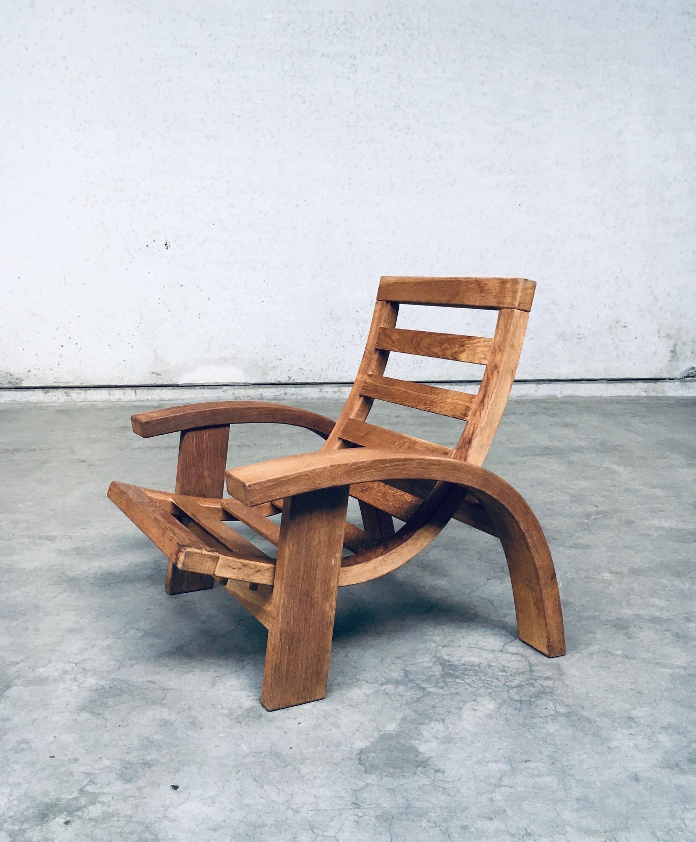 Original and one of a kind Postmodern Design solid oak adjustable Lounge Chair. Made in Belgium, 1980's / 90's period. Solid oak constructed arm chair with adjustable seat. Architectural in design with beautiful forms. This lounge chair has been