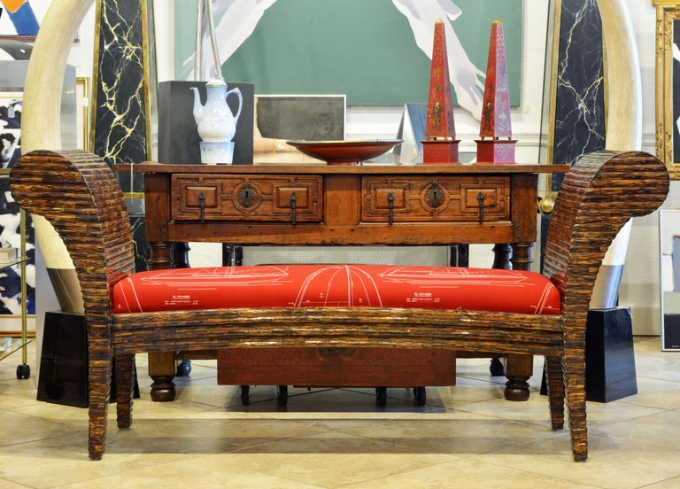 Of bold design and with unique surface texture and color this Postmodern bench by Enrique Garcel is sure to stand out. It is recently reupholstered and covered with Ralph Lauren Voyager fabric. The bench retains the original Enrique Garcel label.
