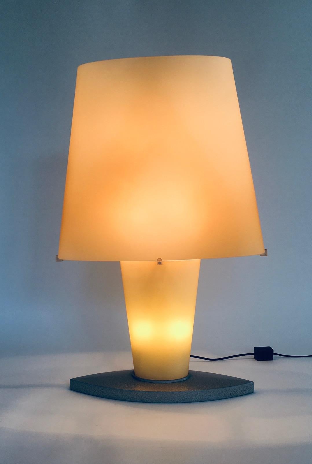 Postmodern Design XL Glass Table Lamp by Daniela Puppa for Fontana Arte. Made in Italy, 1980's/90's period. Model 2892. This is the XL table lamp model. Frost glass in a yellow color with a metal base. The lamp can be lit up in 2 fases. The bottom