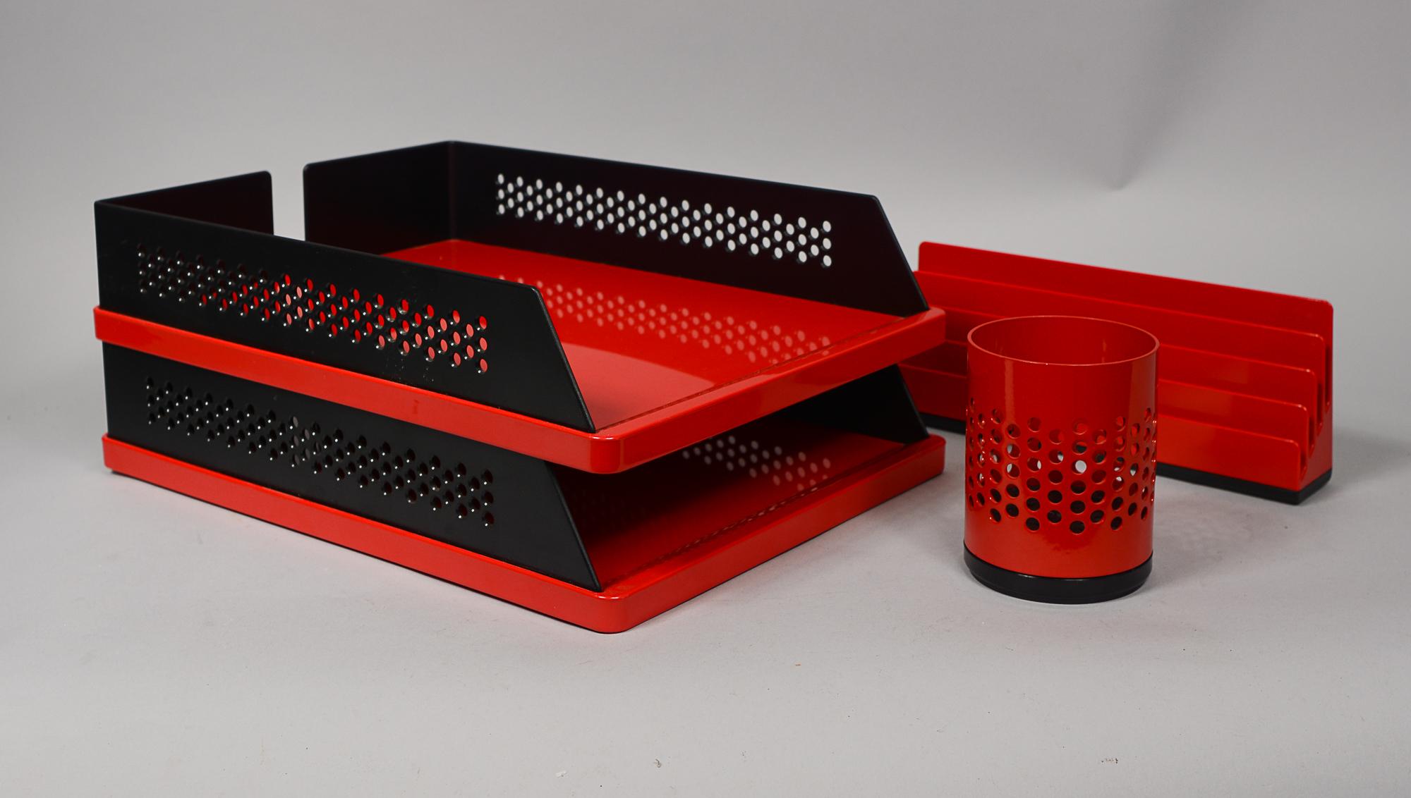 Postmodern desk accessories by Rexite. These include two letter trays, a letter holder and pen or pencil holder. The designers of these are Raul Barbieri and Georgio Marianelli for the letter trays, Rino Pirovano for the letter holder and Studio