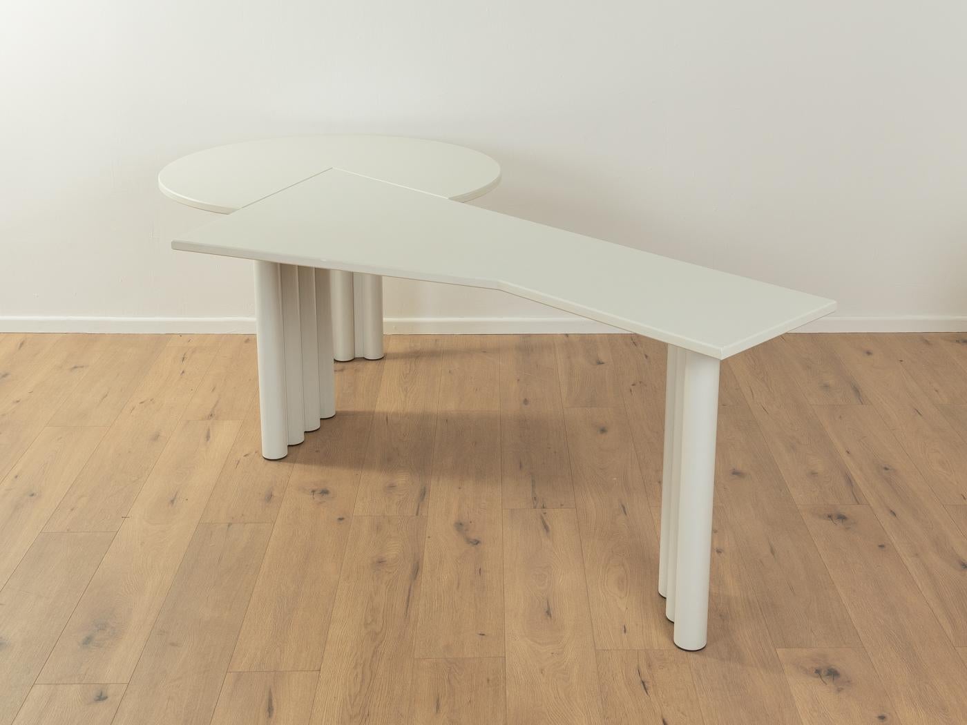 Postmodern desk by interlübke from the 1980s. High quality desk with a white asymethric working surface and white lacquered tubular steel legs.

Quality Features:

    very good workmanship
    high-quality materials
    Made in Germany,