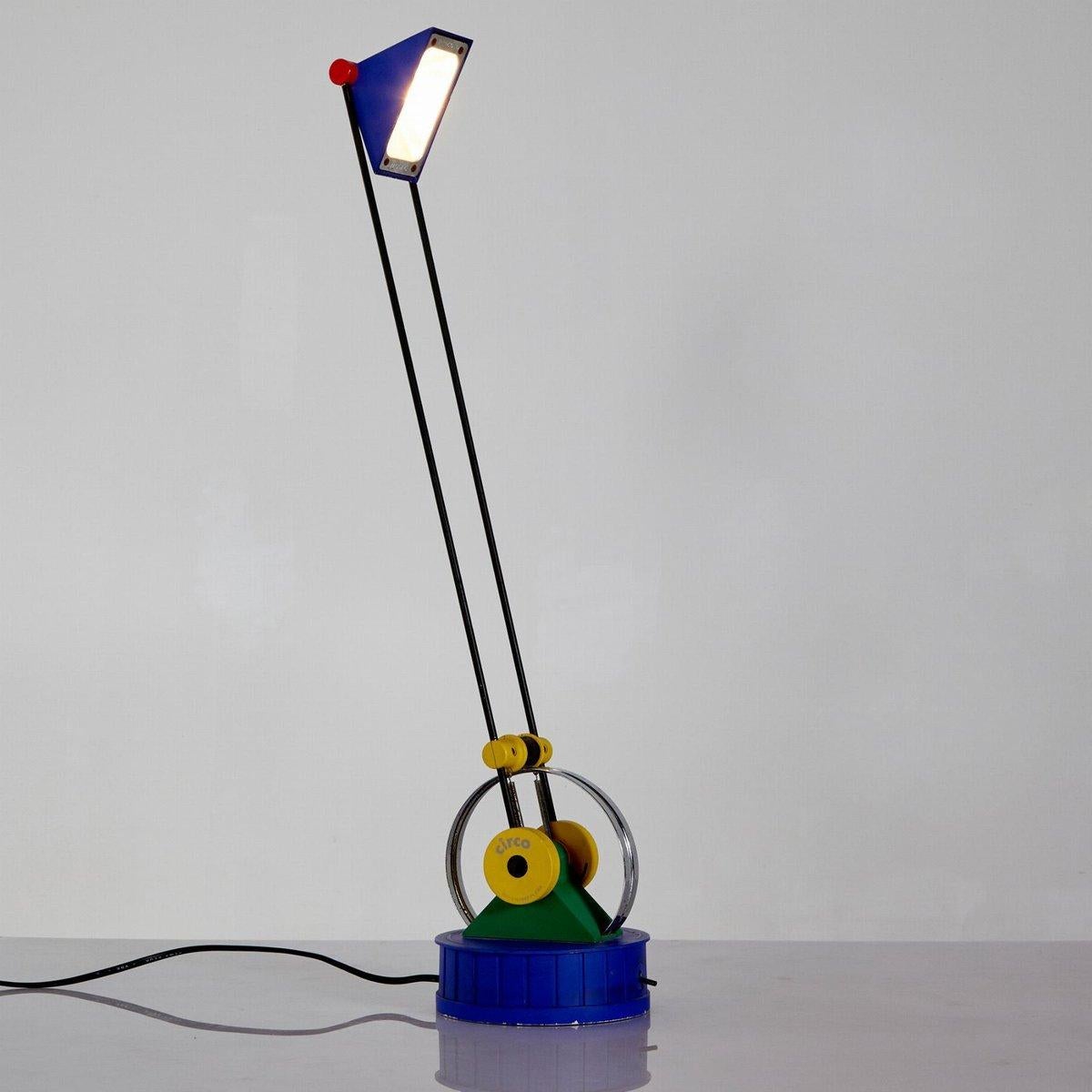 In this listing you will find a beautiful and rare Circo Lamp designed by Linke Plewa for Brilliant Leuchten, Germany. This lamp is a perfect example of Memphis design, featuring all the key colours and the minimalist design of the mentioned style.