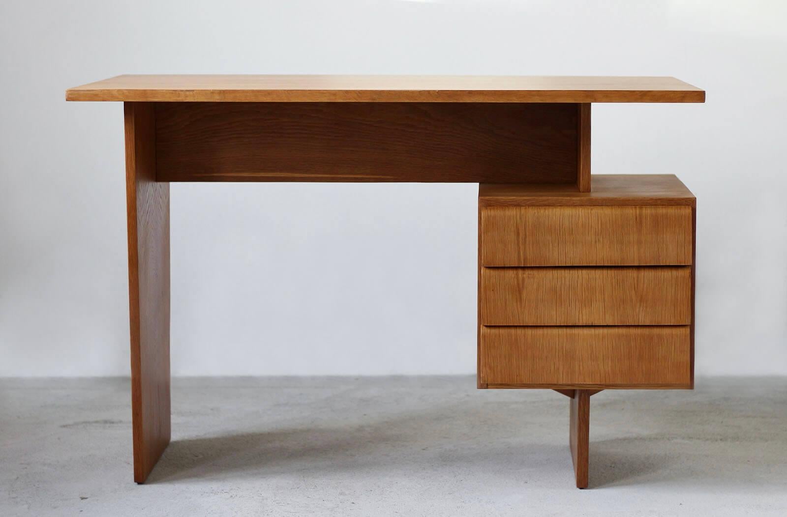 This desk was designed by Bohumil Landsman in 1970s. The design is very simple and elegant. It features a section with 3 practical drawers. The desk is covered with ash veneer with beautiful wood patterns. The piece is fully renovated, finished with