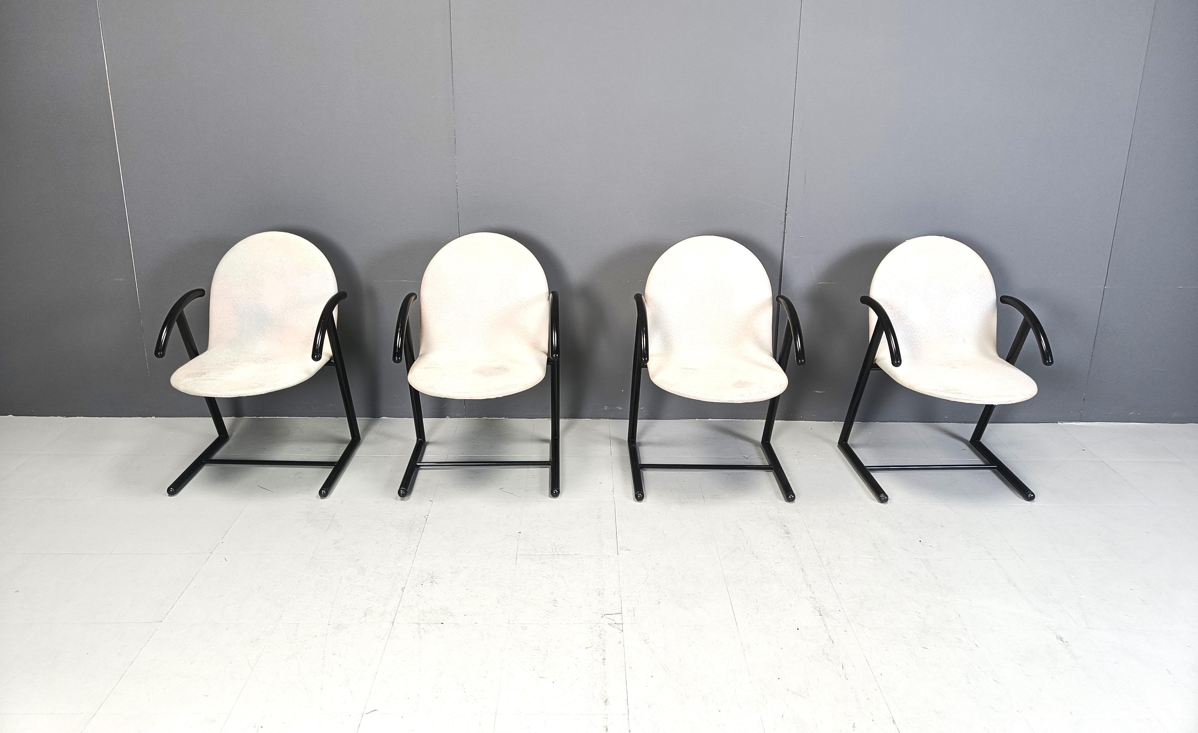 Set of 4 postmodern design armchairs/dining chairs made from black metal frames and black grey fabric seats and backrests.

Timeless design

1980s - Belgium

Good condition

Dimensions:
Height: 83cm
Width: 55cm
Depth: 55cm
Seat height: 45cm

Ref.: