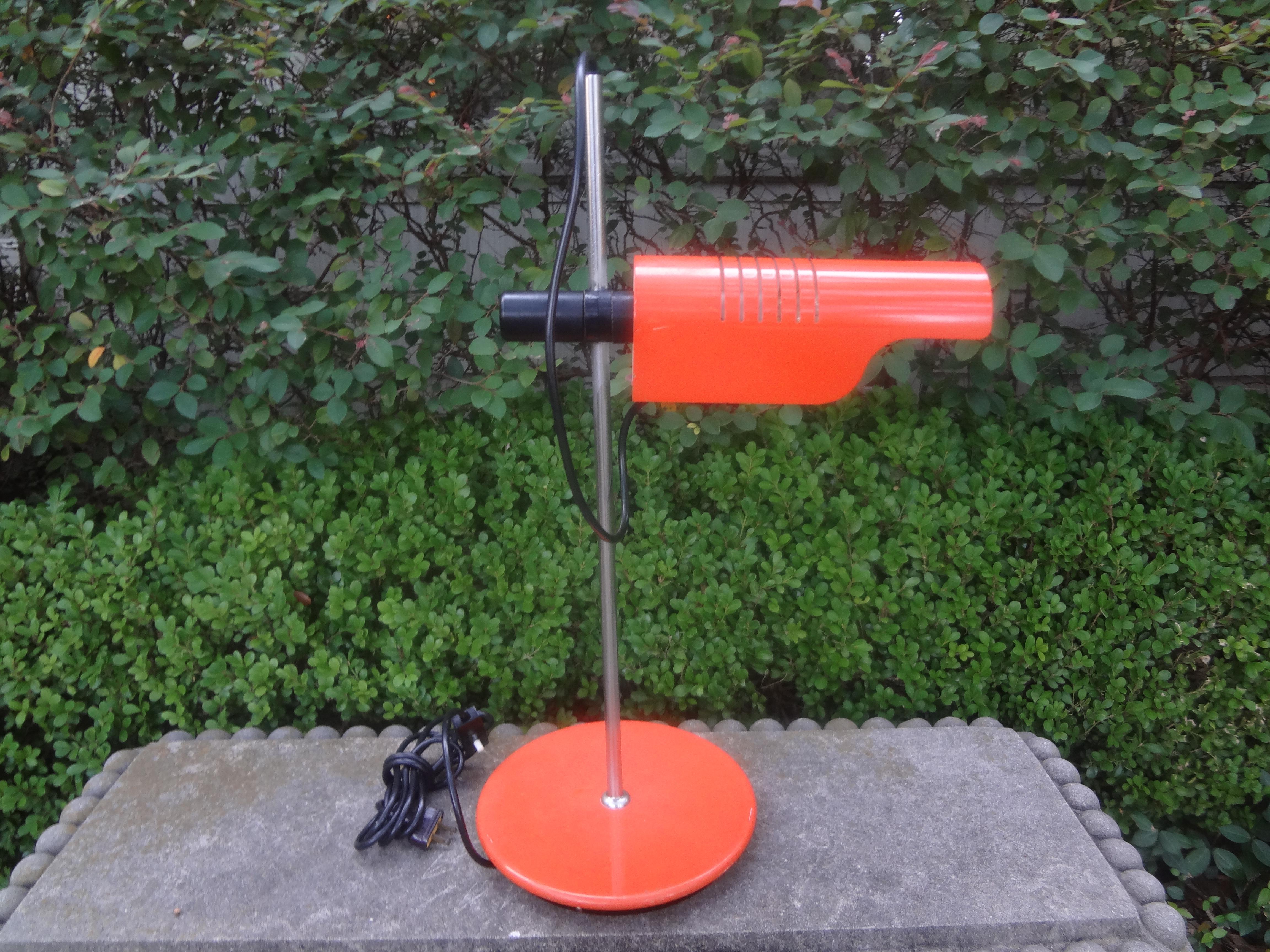 Mid Century Modern Dutch Enameled Metal Desk Lamp.
This sculptural orange enameled designer lamp is an artful way to light your desk.
Beautifully executed with attention to detail and newly wired for the U.S. market with an Edison socket.