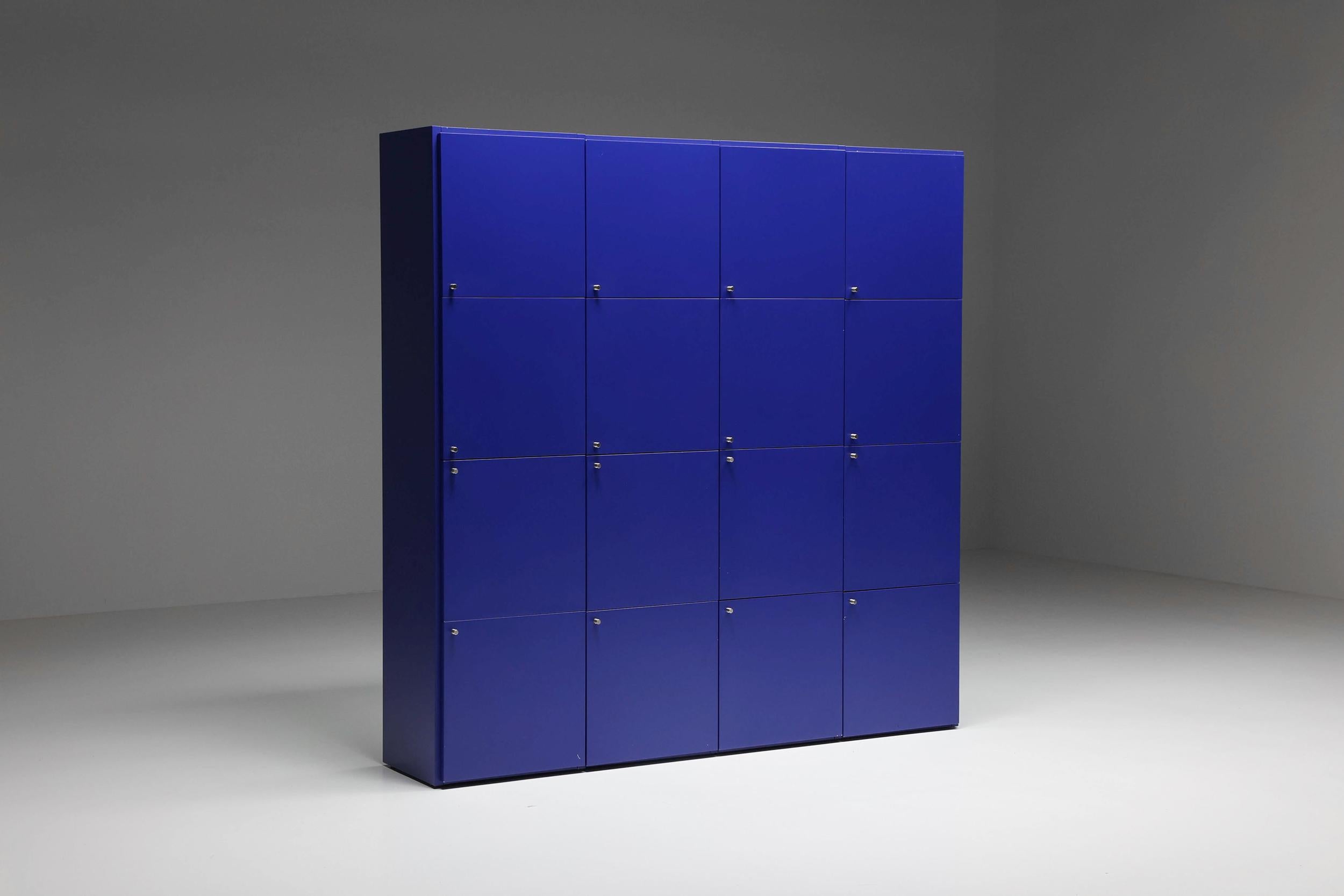 Edra Cabinet; Postmodern; Edra; Paesaggi Italiani; Bookcase; 1960's; 

Postmodern Edra Paesaggi Italiani bookcase made in the 1960s. This sixteen cube storage element includes doors made in blue-colored laminate. Perfect for storing items and
