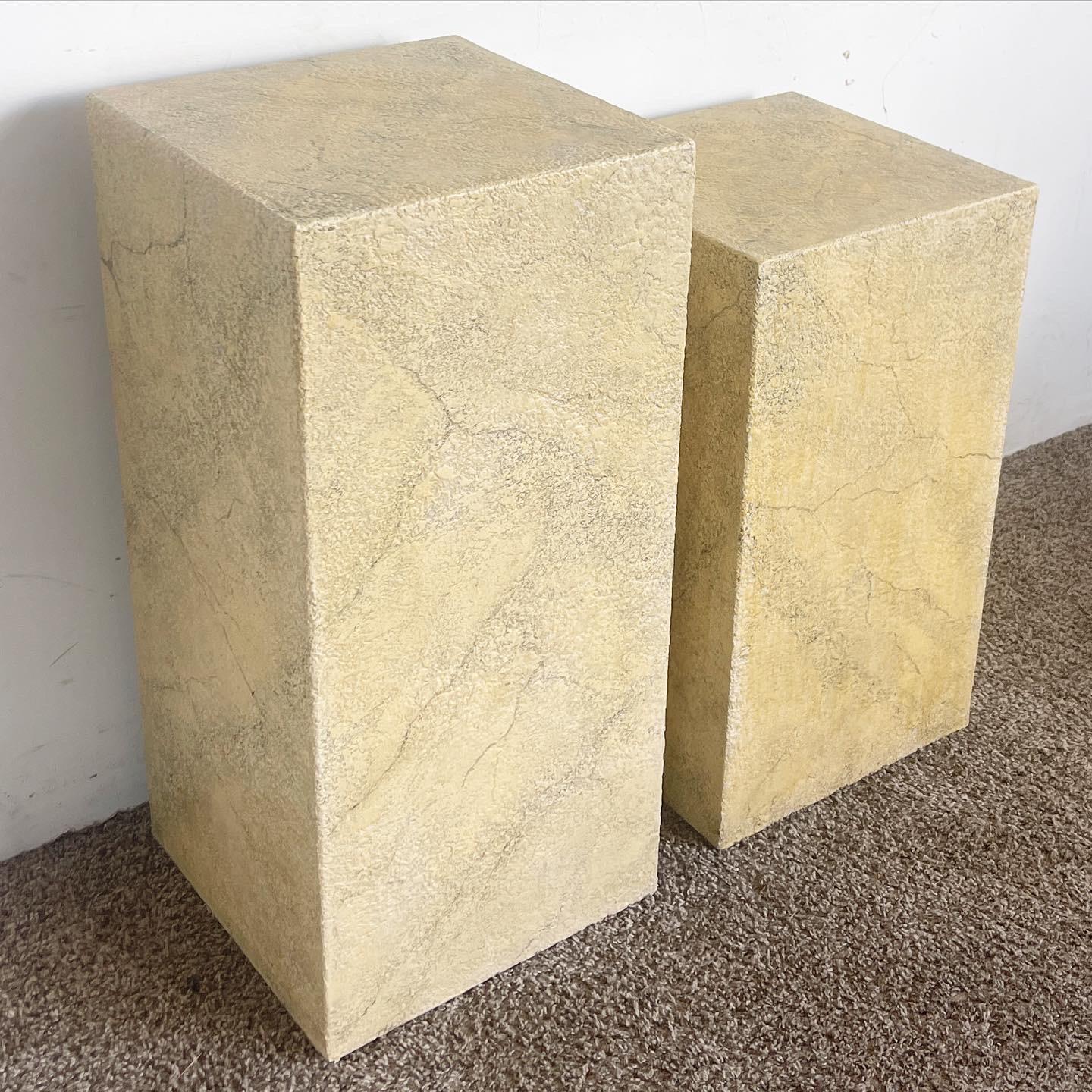 Enhance your interior with a pair of Postmodern Faux Beige Stone Pedestals, crafted for versatility and sophistication, perfect for showcasing art pieces.

Crafted to resemble authentic stone with a timeless beige hue.
Perfect for showcasing