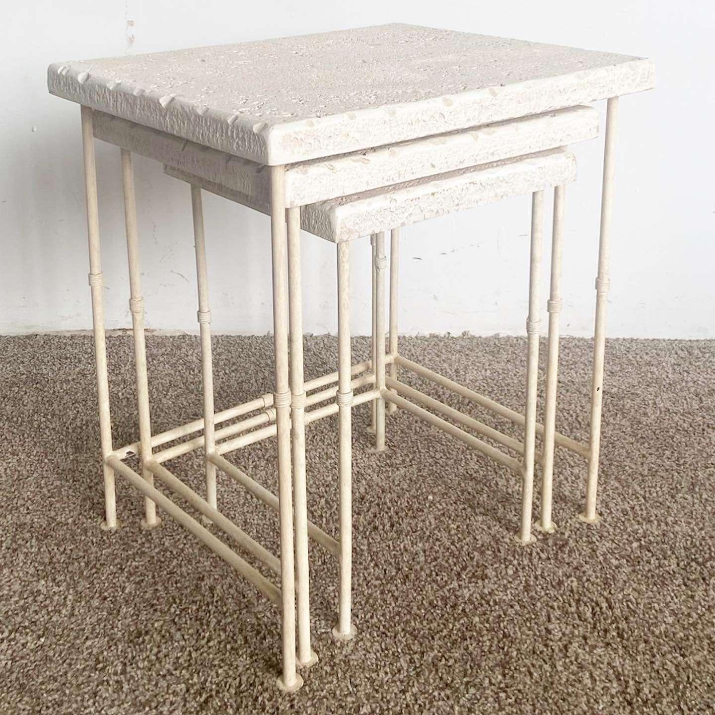 Exceptional vintage postmodern set of 3 rectangular nesting tables. Each feature a faux coral top with metal faux bamboo legs.

Medium table measures 18”W, 16”D, 22”H
Smallest table measures 14”W, 20.5”H