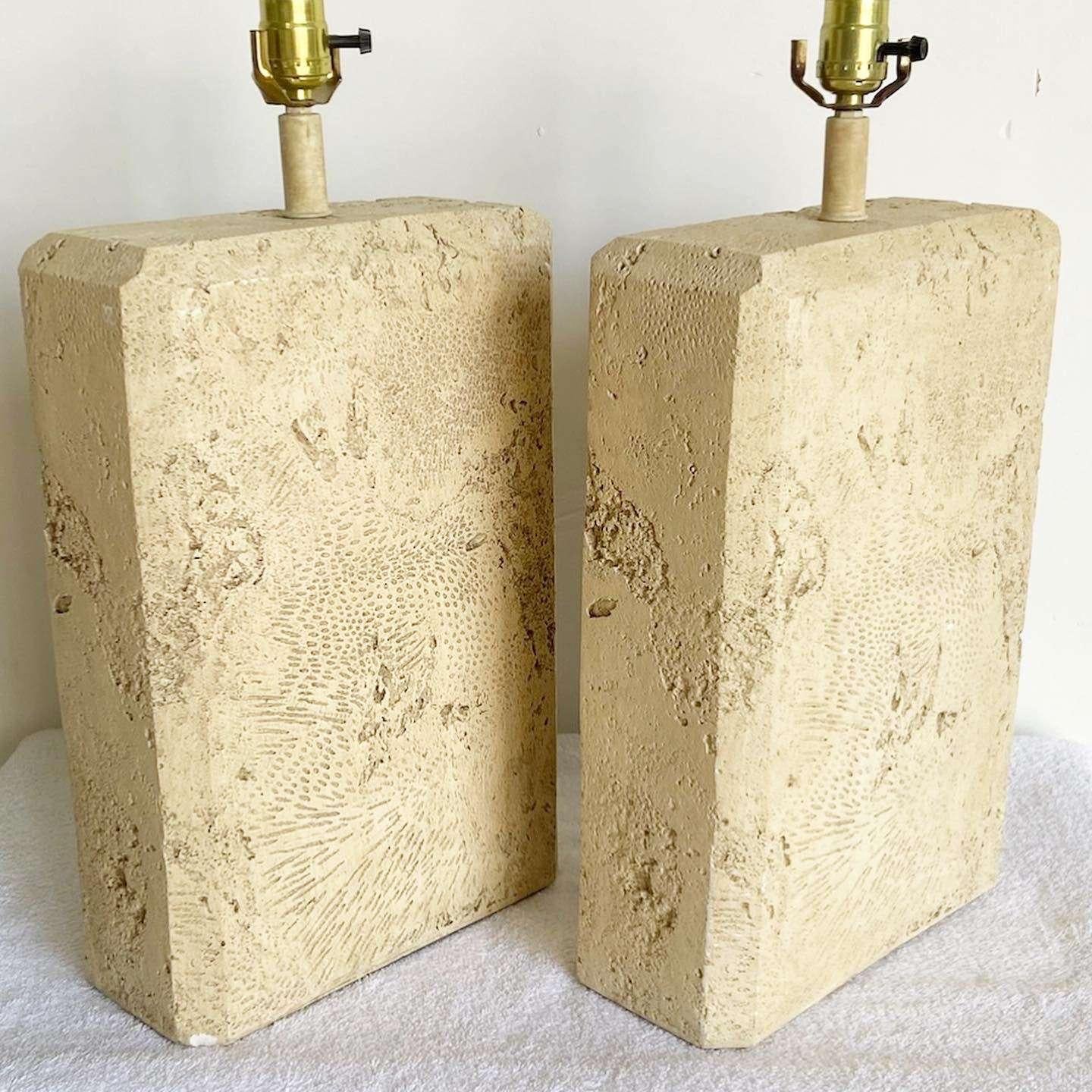 Exceptional pair of vintage postmodern rectangular table lamp. These tablet shaped lamps are worthy of carrying down from the mountain to your people as truth. Each are comprised of a faux fossilized stone.