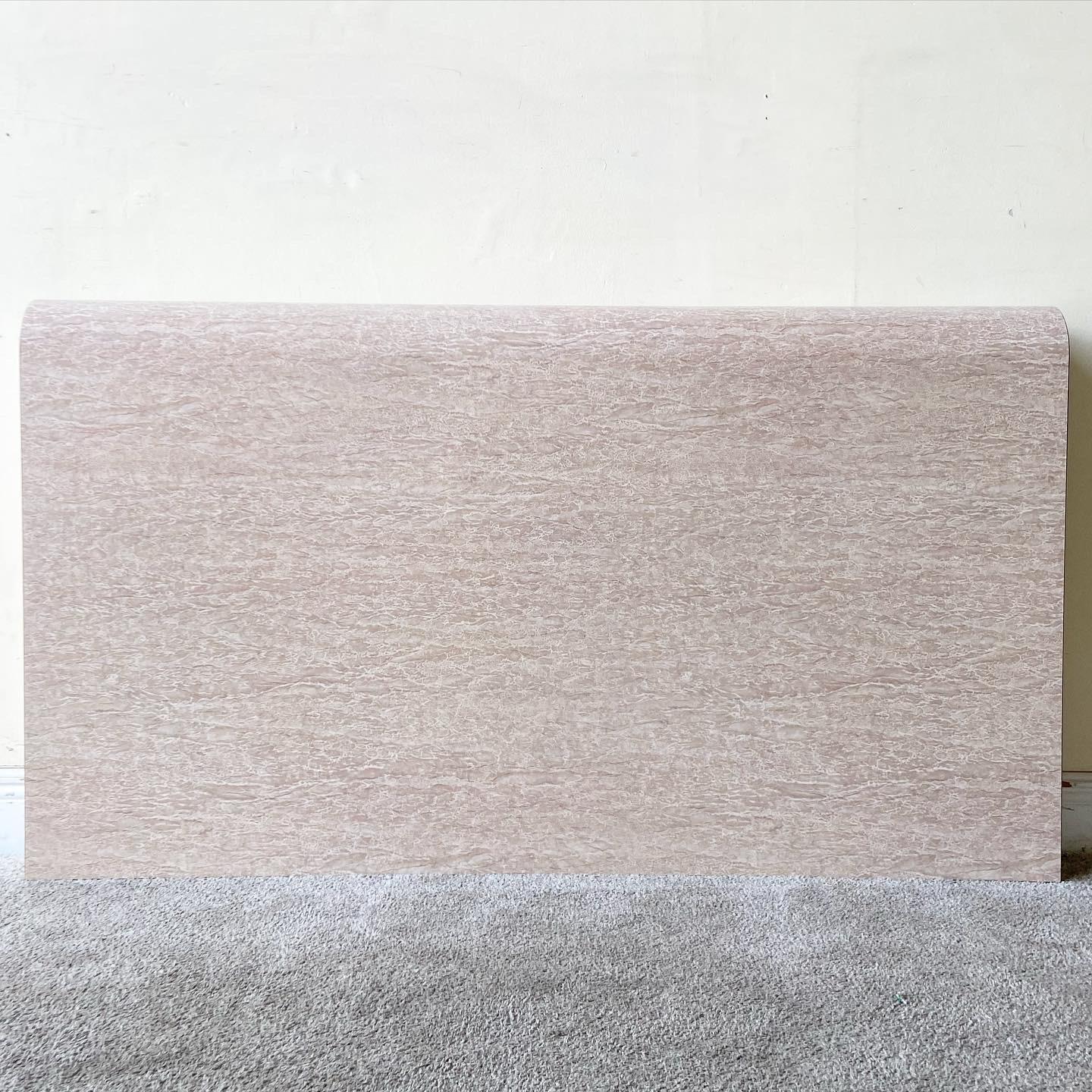 Exceptional postmodern waterfall headboard. Features a tan/beige faux marble laminate.