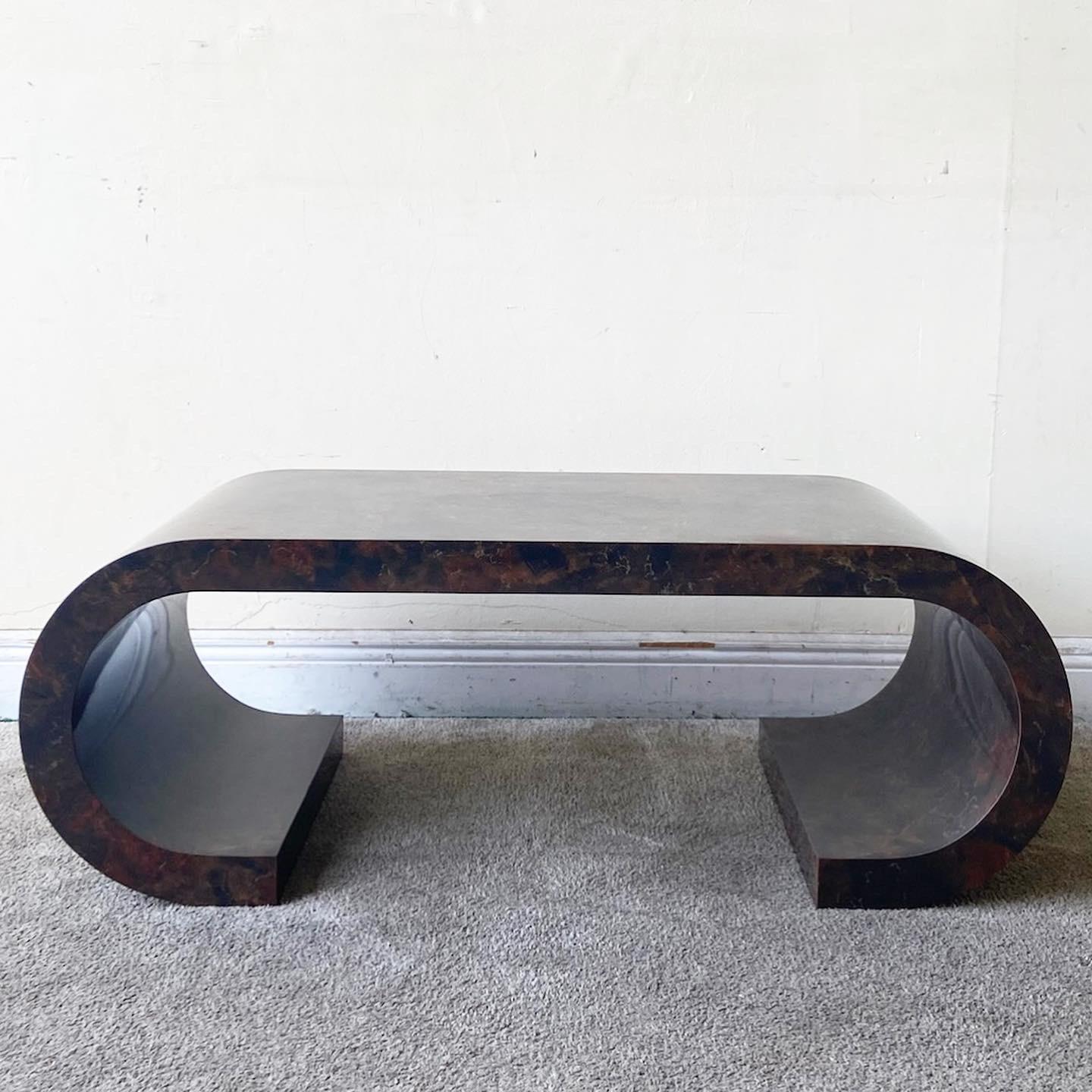 Exceptional postmodern coffee table. Features a faux marble laminate.
 