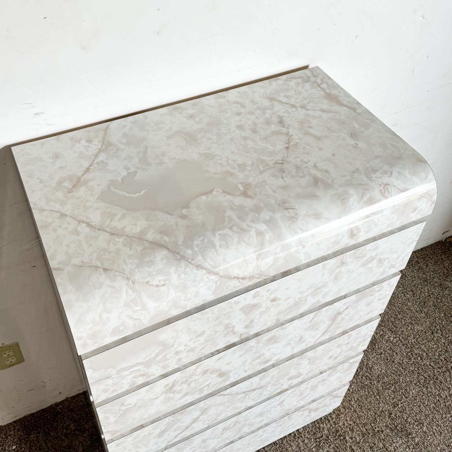 Transform your bedroom with the Postmodern Faux Marble Laminate Waterfall Highboy Dresser, a striking fusion of style and functionality. Featuring a unique waterfall silhouette and a faux marble laminate finish, this highboy dresser offers ample