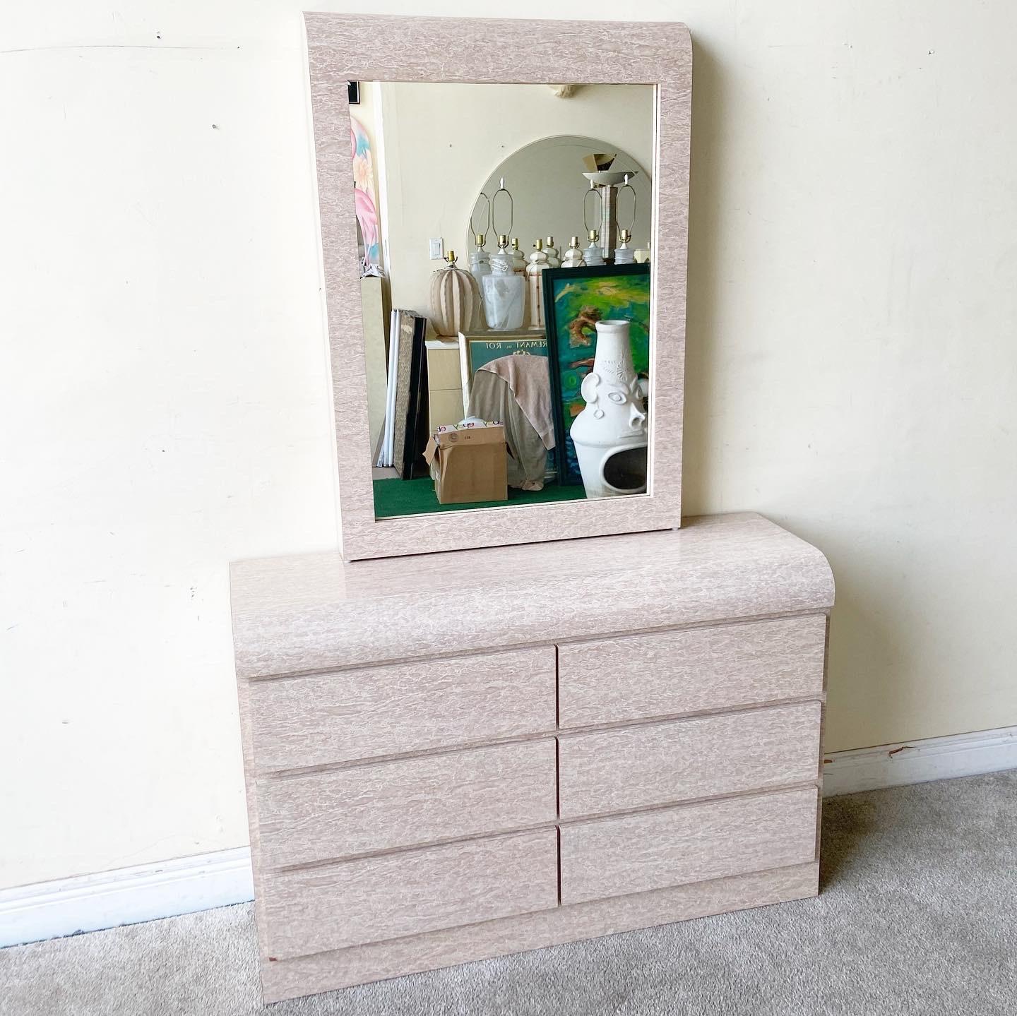 Amazing 1980s postmodern waterfall dresser with matching mirror. Features a tan/beige faux marble laminate with 6 spacious drawers. Dresser measures 48”W, 15.5”D, Mirror measures: 30.25”W, 4”D, 42.5”H