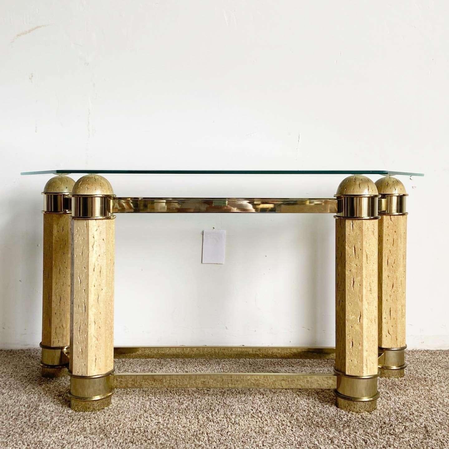 Exceptional vintage postmodern beveled glass top console table. Features a faux stone vase with brass accents.
