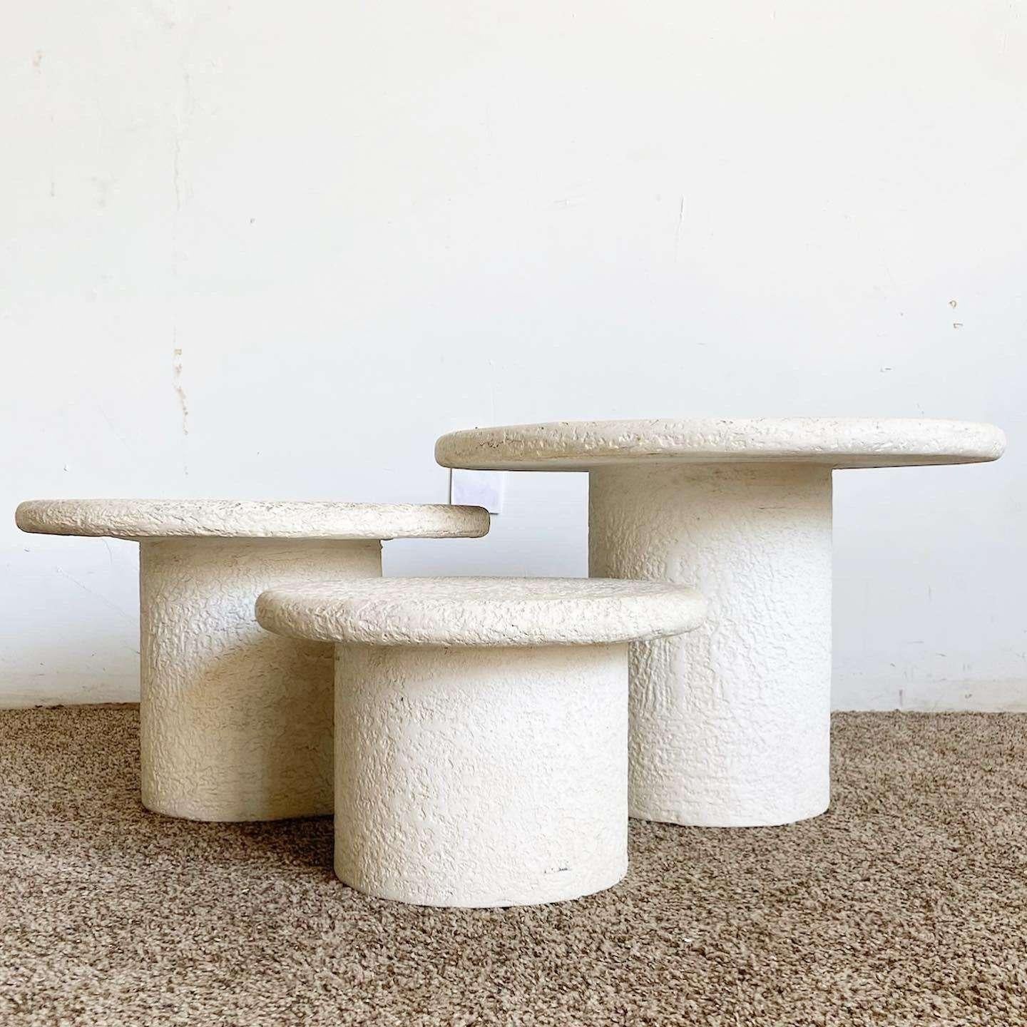 Incredible set of 3 vintage postmodern mushroom nesting side tables. Each a textured “stucco” off white finish.

Small table measures 16”W, 10.5”H
Medium table measures 20”W, 13.5”H