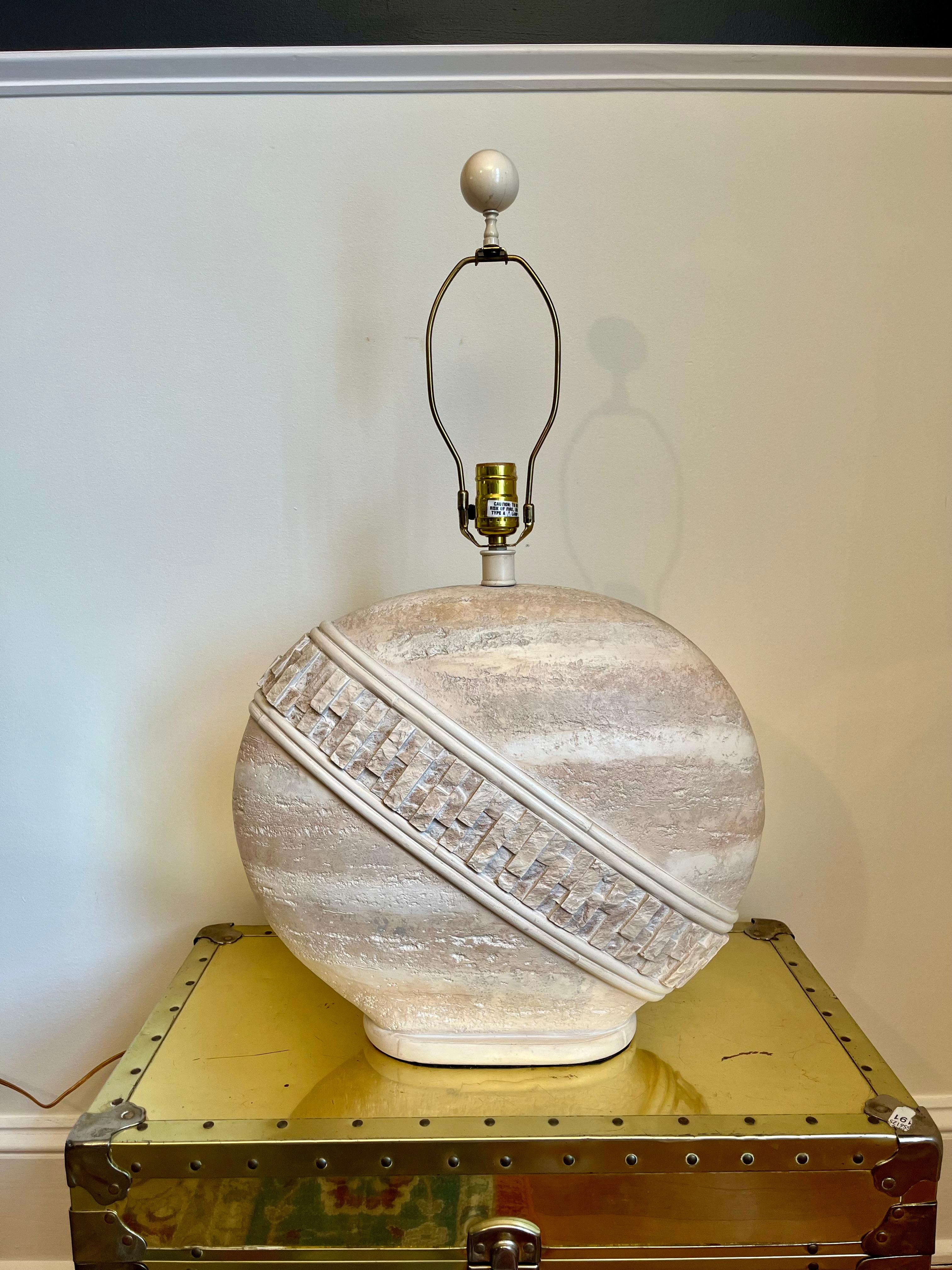Exceptional vintage postmodern lamp. Features a beige faux tessellated stone with a polished upper section. Nice visual with angular detailing set on oval form. Pacific Coast MFG.