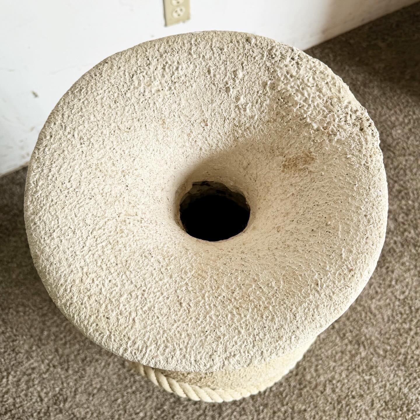 Add a touch of postmodern artistry to your space with this Faux Tessellated Stone Plaster Floor Vase, adorned with a sculpted rope design. Crafted from plaster ceramic, it mimics tessellated stone and textured rope, creating a captivating illusion.