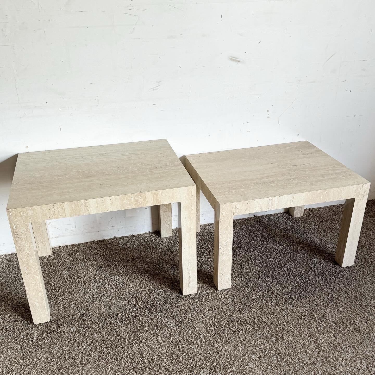 Discover the sophisticated charm of these Postmodern Faux Travertine Laminate Parsons Side Tables, available as a pair with heights of 22 inches and 18 inches, respectively. These tables embody the sleek, minimalist design of the Parsons style, with