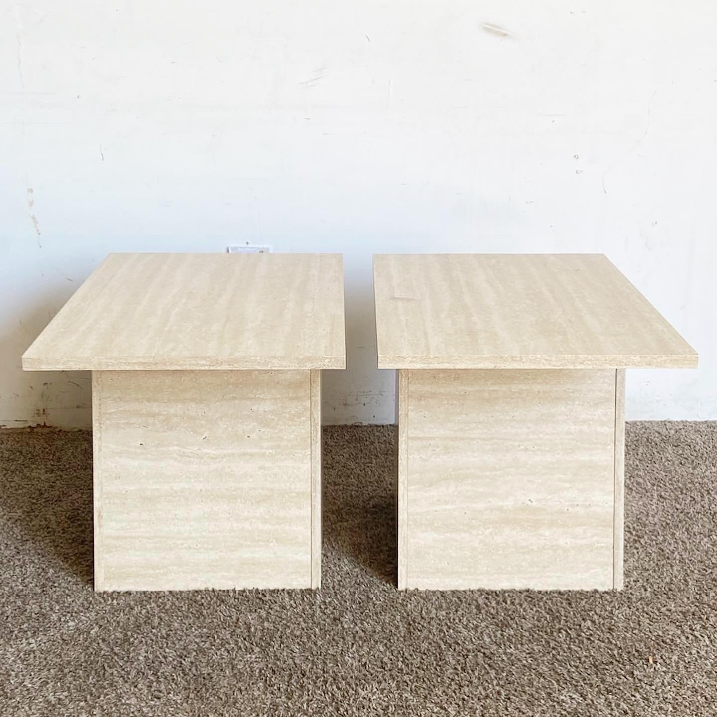 Upgrade your interior with these Postmodern Faux Travertine Laminate Side Tables. Designed to mimic genuine travertine, this pair of tables blends luxury and affordability, all in a sleek, minimalist design.
Minor wear around the edges as seen in