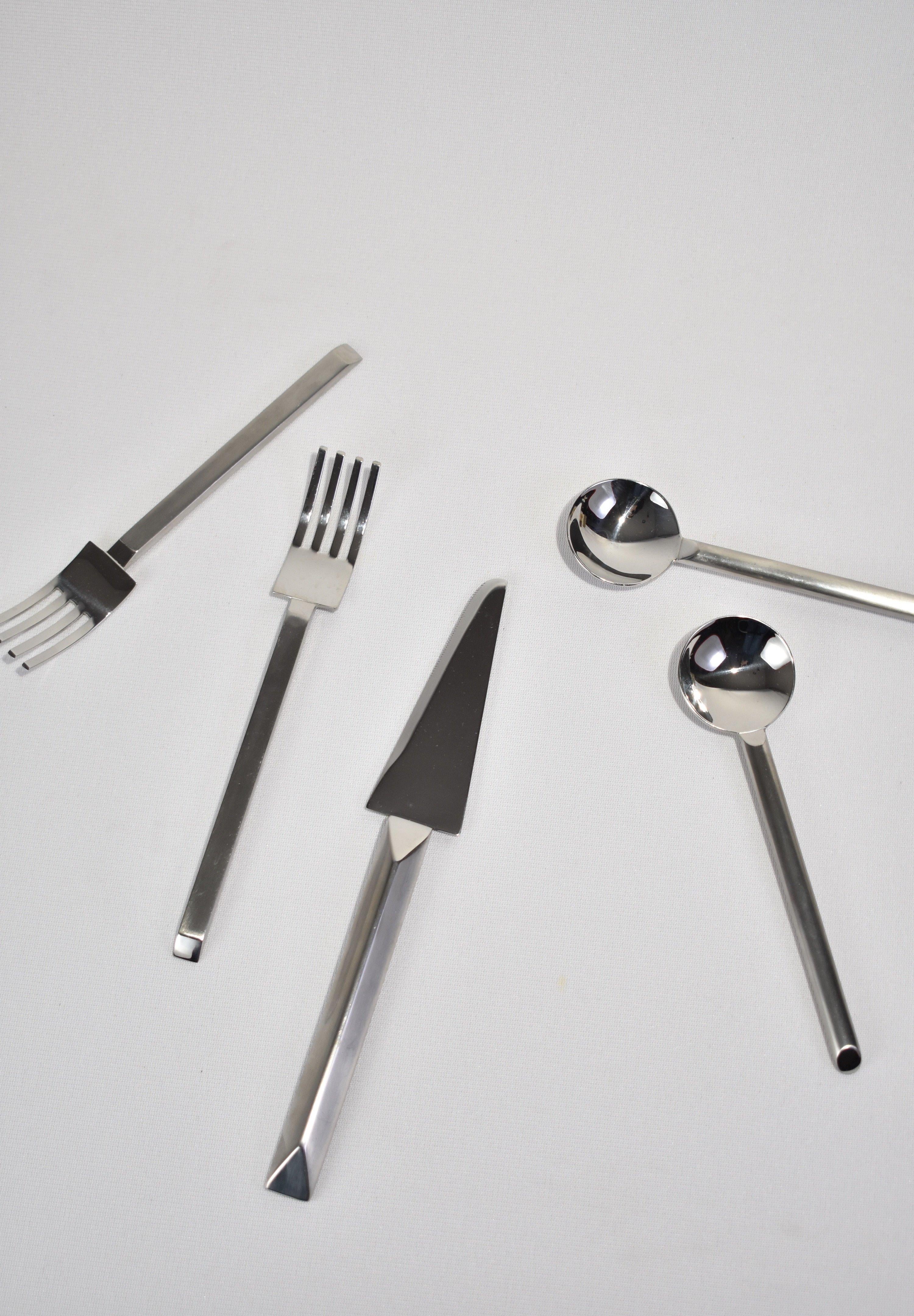 Rare, stainless steel sculptural flatware set by Kam Yamazaki. Crafted in Japan, ca. 1993. 

Dimensions:
Knife: 9.5