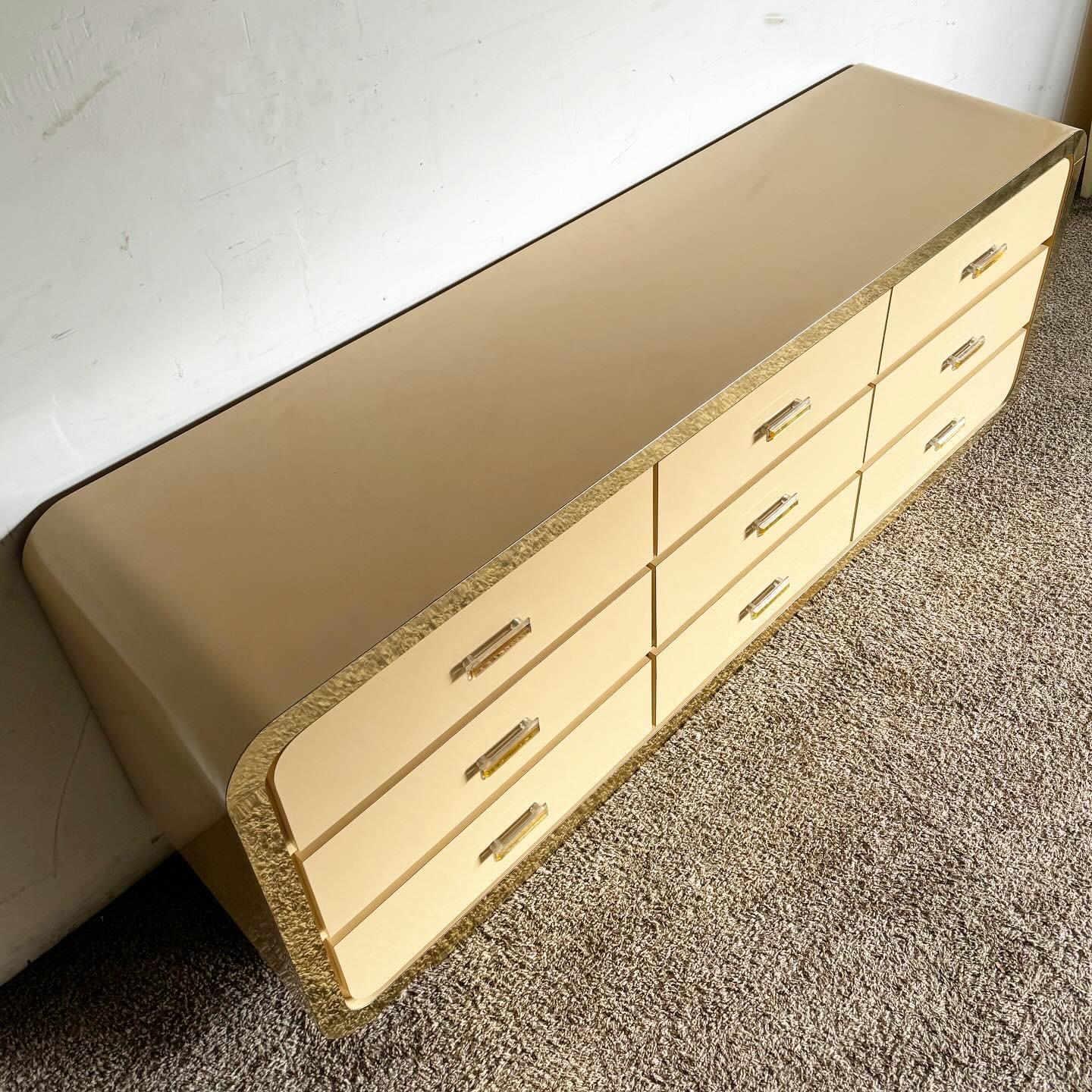 Postmodern Flesh Lacquer Laminate Waterfall Dresser With Gold Accents In Good Condition For Sale In Delray Beach, FL
