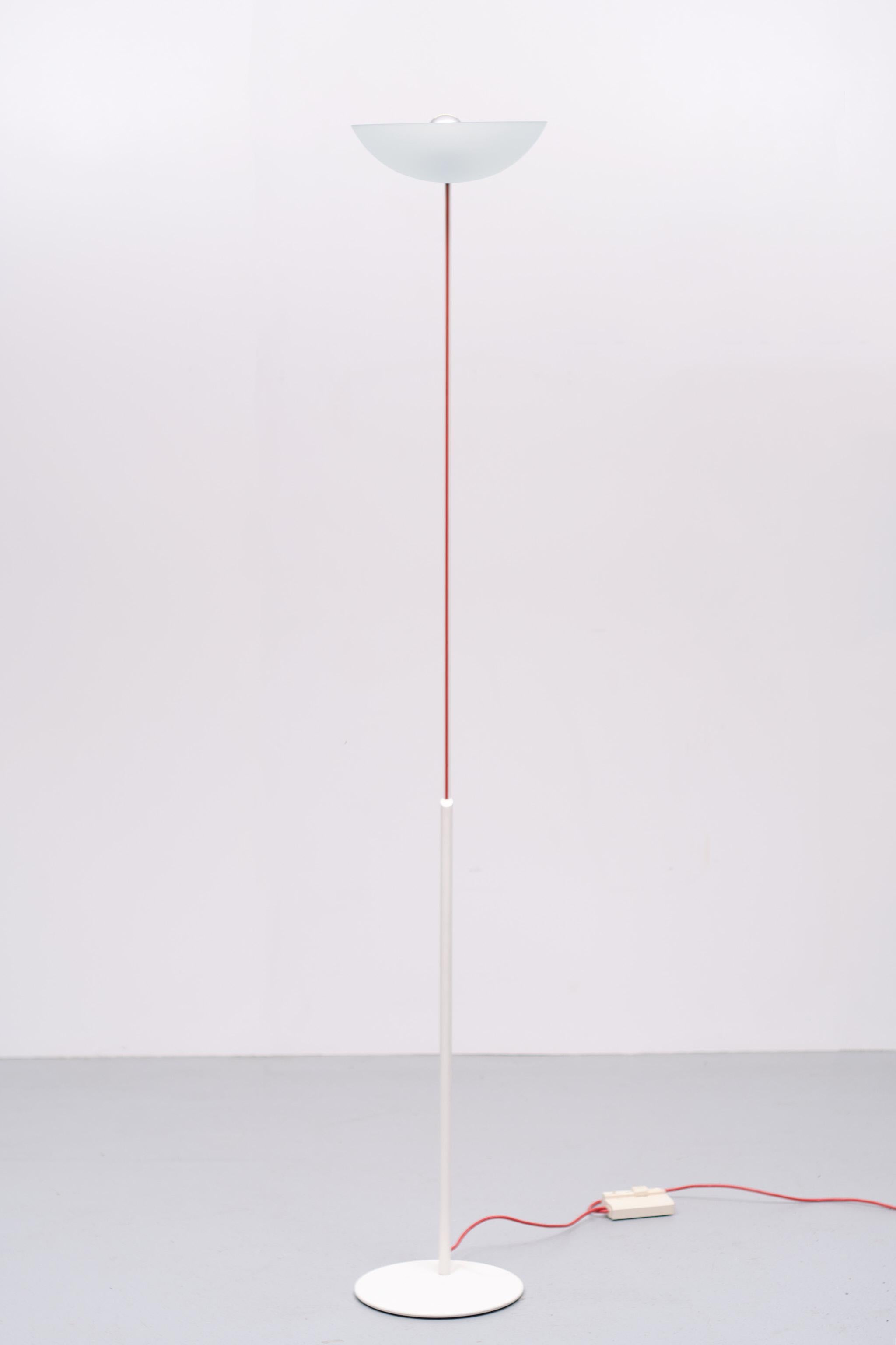 Very nice sleek Postmodern Italian floor lamp. High gloss White Metal upright 
comes with a Glass scale shade. The Red power cord is a nice detail.
rare find. Signed. One E27 bulb needed. working dimmer. Very good condition.