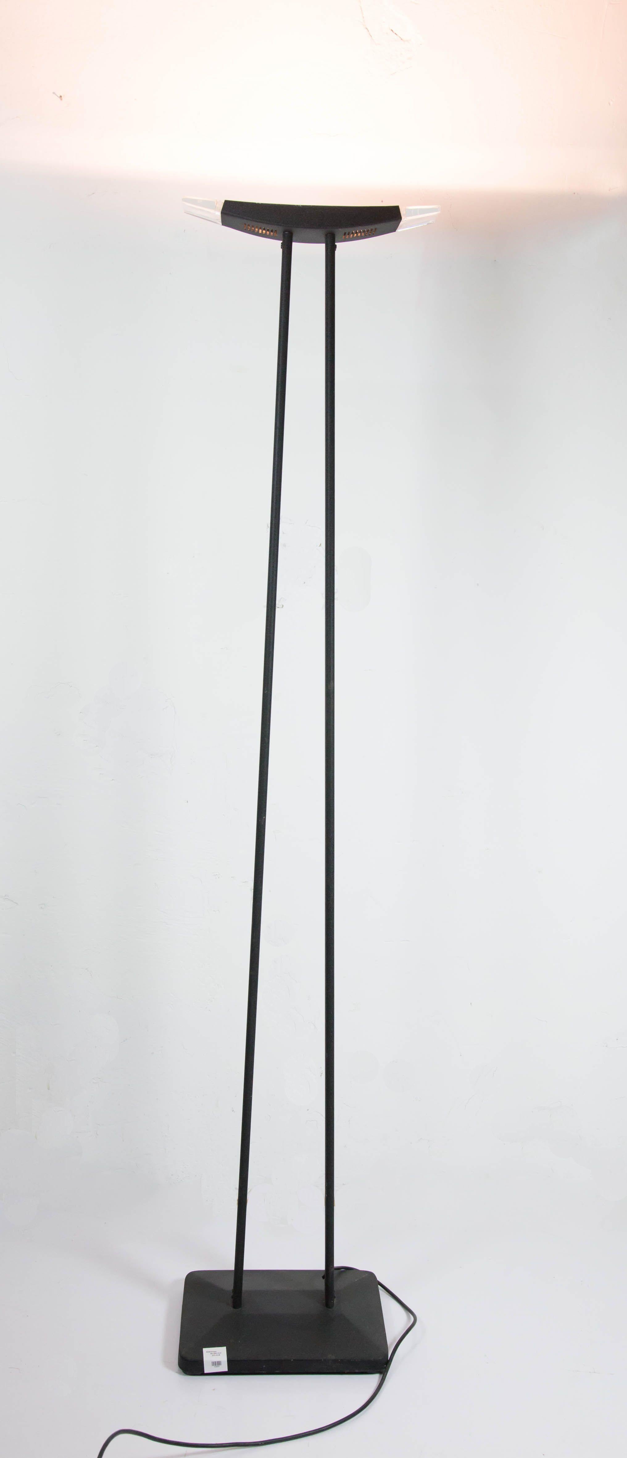 This Postmodern floor lamp, from the 1980s features a dark, texture charcoal/gunmetal painted finish and clear plexiglass accents on the top.
It's in great condition. This vintage item has no defects, but it may show slight traces of use. European