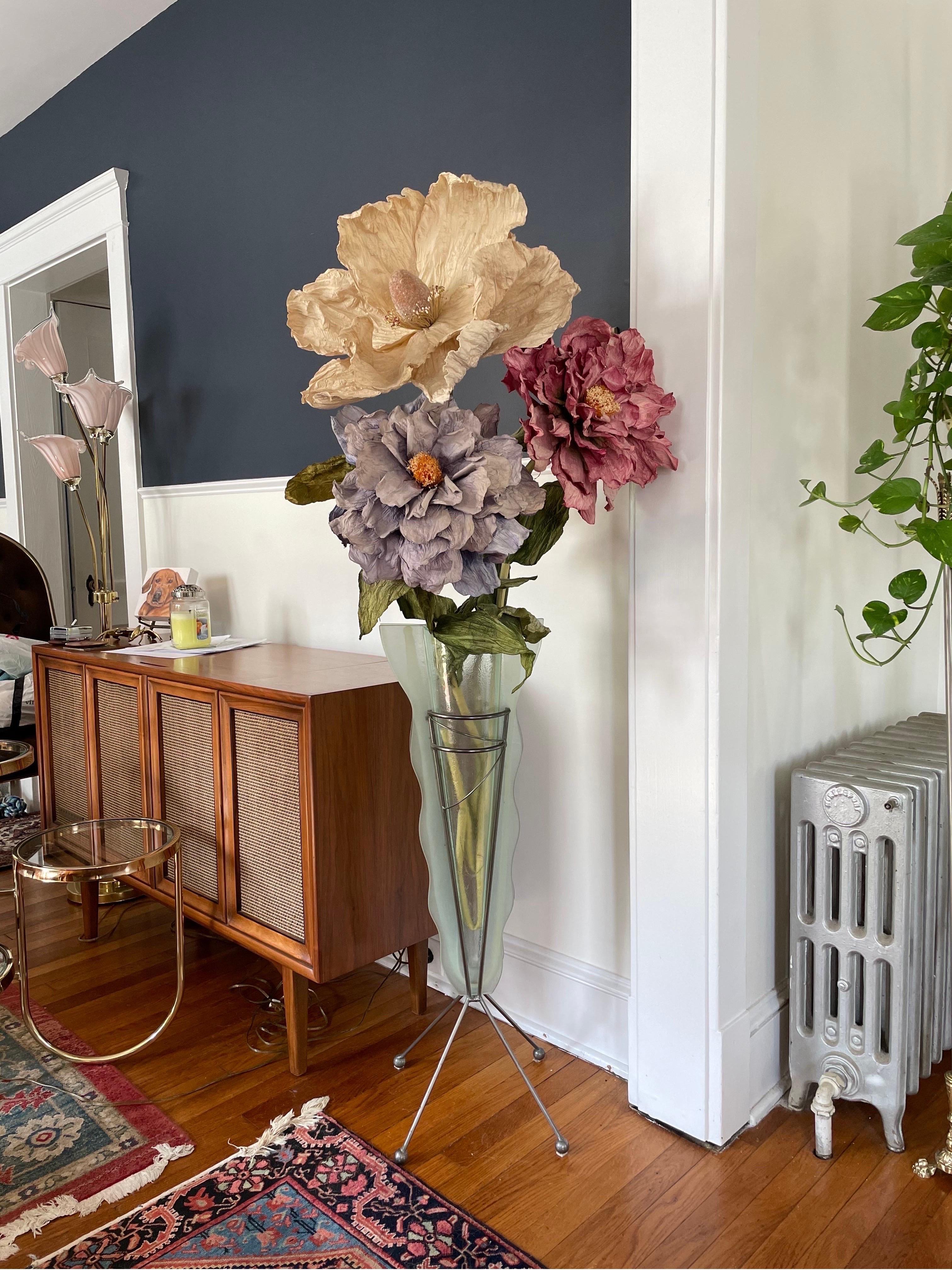 Stunning postmodern floor Vase with artificial flowers. Commanding presence. Floor Vase has postmodern lines and frosted wavy edge outlines a clear textured vessel. Flowers have wire stems and leaves for positioning.