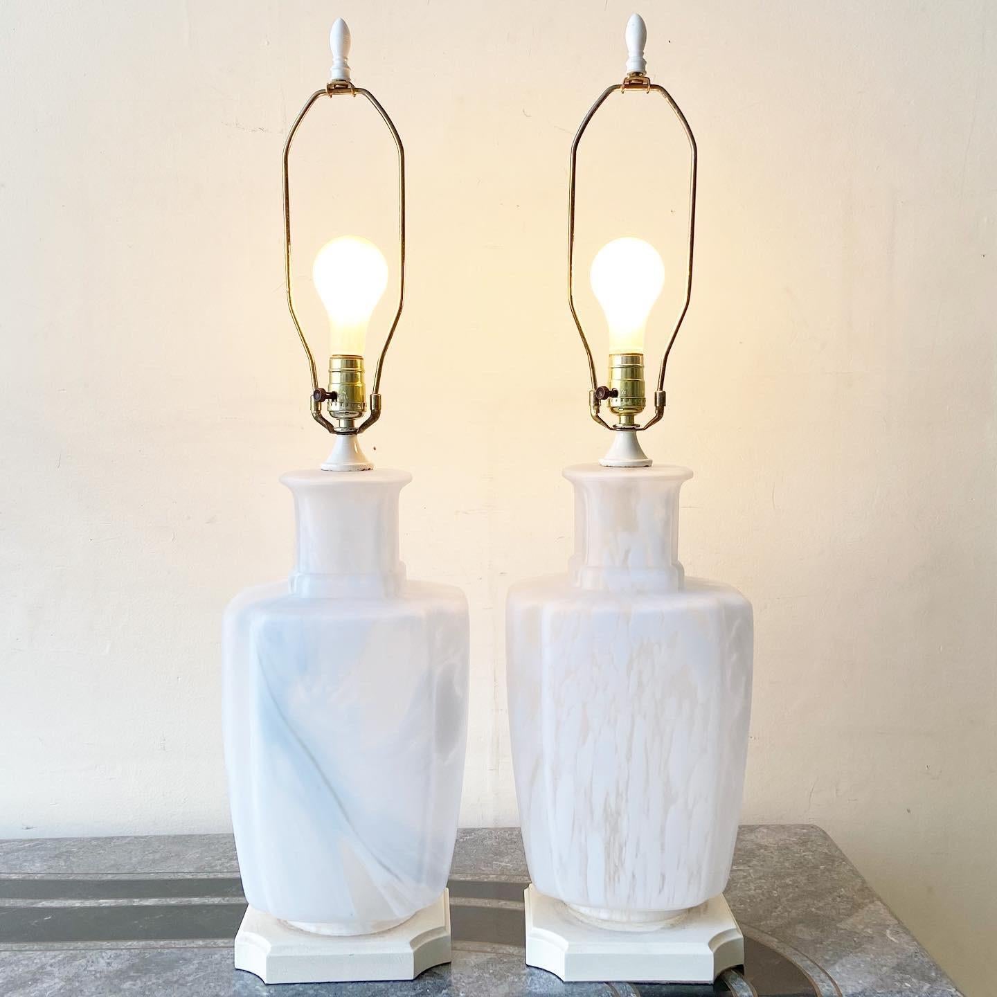 Incredible pair of mottles Murano style frosted glass table lamps. Each lamp has 3 light settings: base light, top bulb, and both.
 