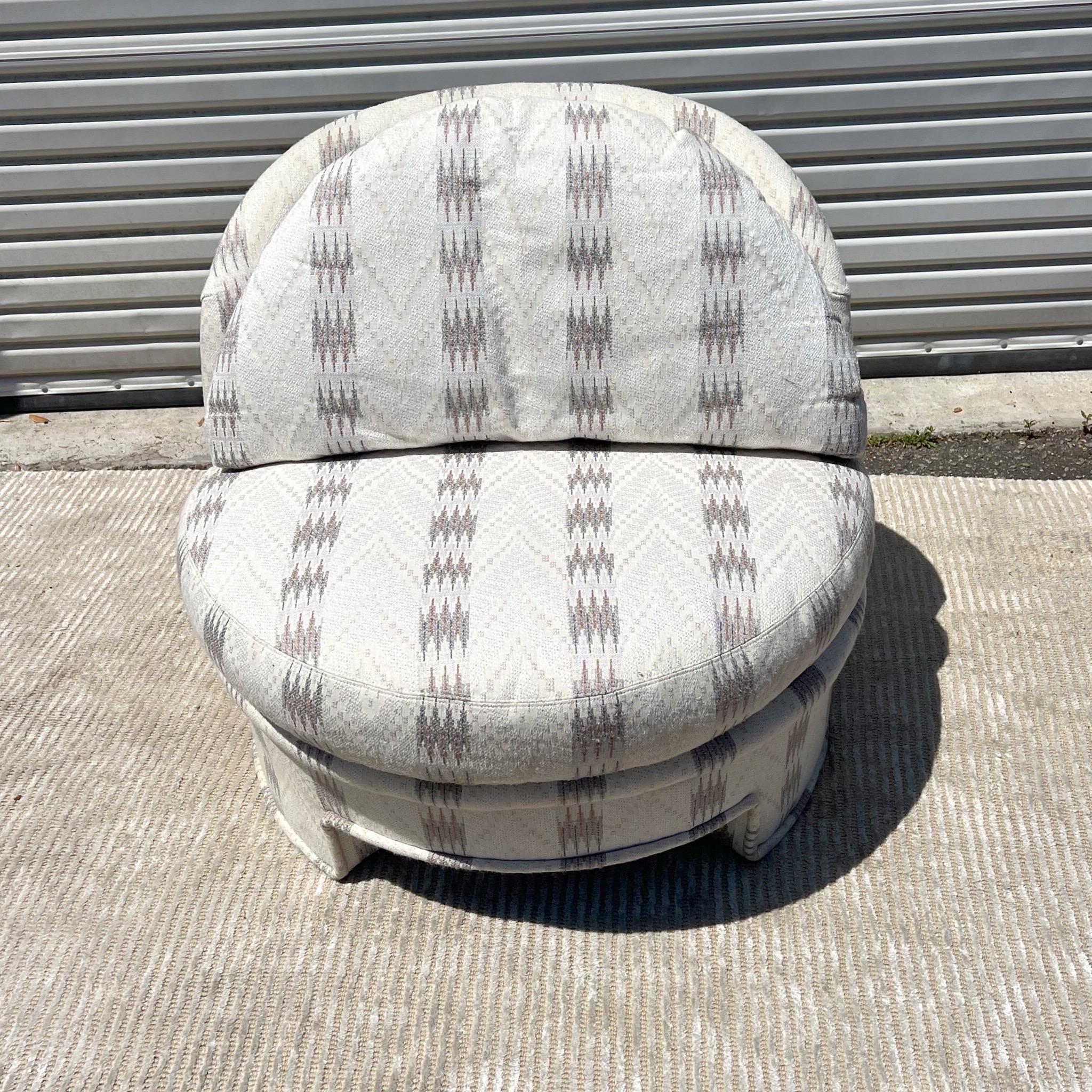 Here we have an extremely cozy half moon style accent chair with a nice looking southwestern upholstery fabric. Circa 1980’s. The cream fabric has been well taken care of a no visible stains or tears. The lines are very postmodern and the fabric