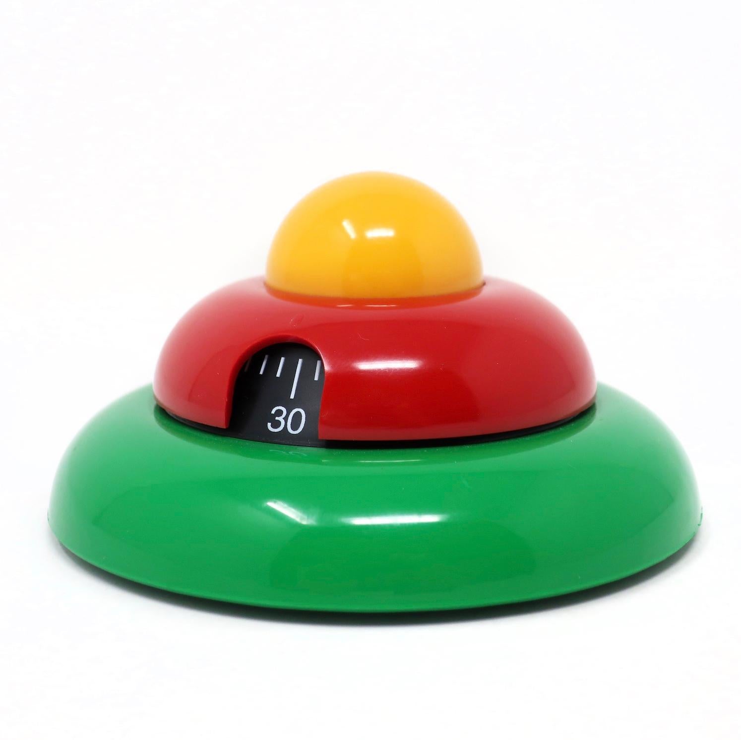 A whimsical Italian postmodern multicolor kitchen timer designed by Roberto Pezzetta for WikiDue. Stacked green, red and yellow discs give it a fun Memphis Milano. Runs for up to 60 minutes.

In very good vintage condition with slight wear