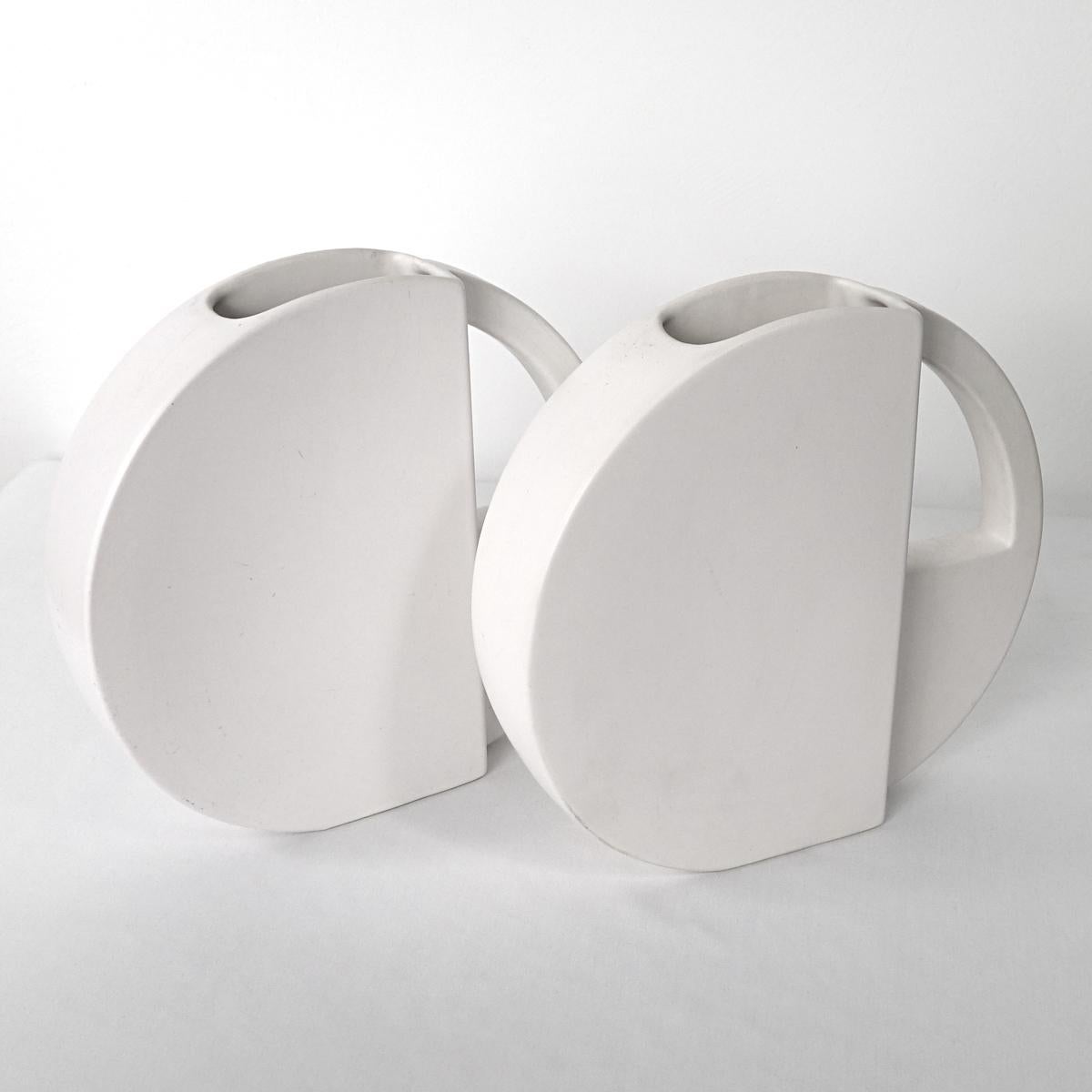 Pair of geometrically shaped ceramic vases with 'built-in' handle. Very easy on the eye.
The vases have been designed by Dorothé van Agthoven for Flora Keramiek Hardenberg Holland.