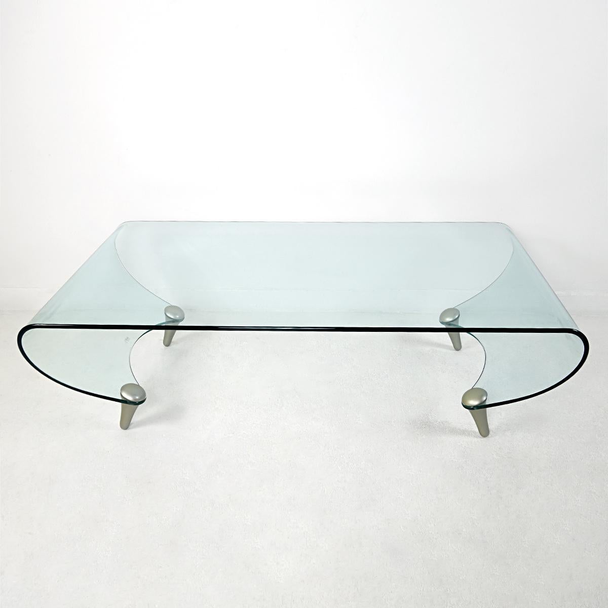 Rare coffee table tango was designed in 1996 by Fabio di Bartolomei for Italian glass specialist Fiam Italia. The table has a glass top surface combined with four silver colored wooden legs.
No longer in production. Signed in the glass: AB IH. Very