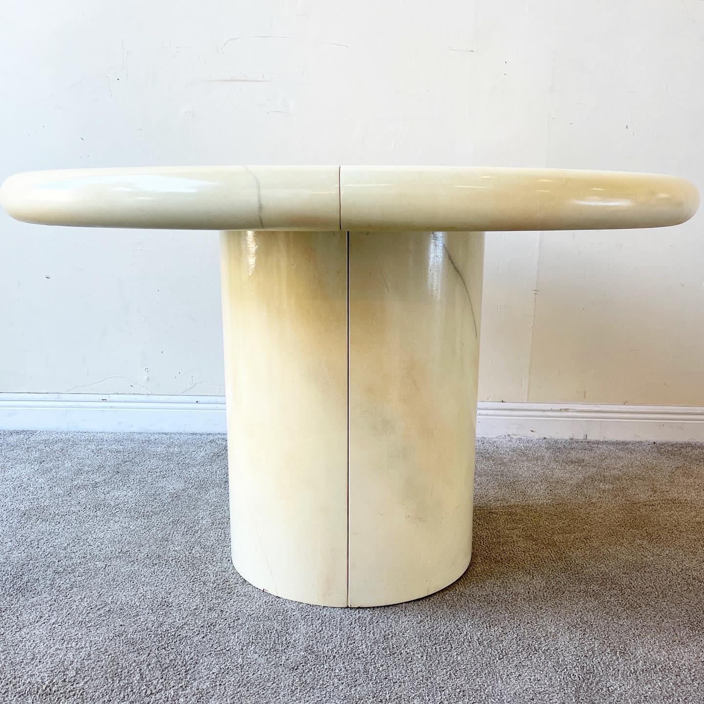 Amazing postmodern mushroom dining table. Features a faux goatskin lacquer over wood. Table can be extended a total of 36 inches.