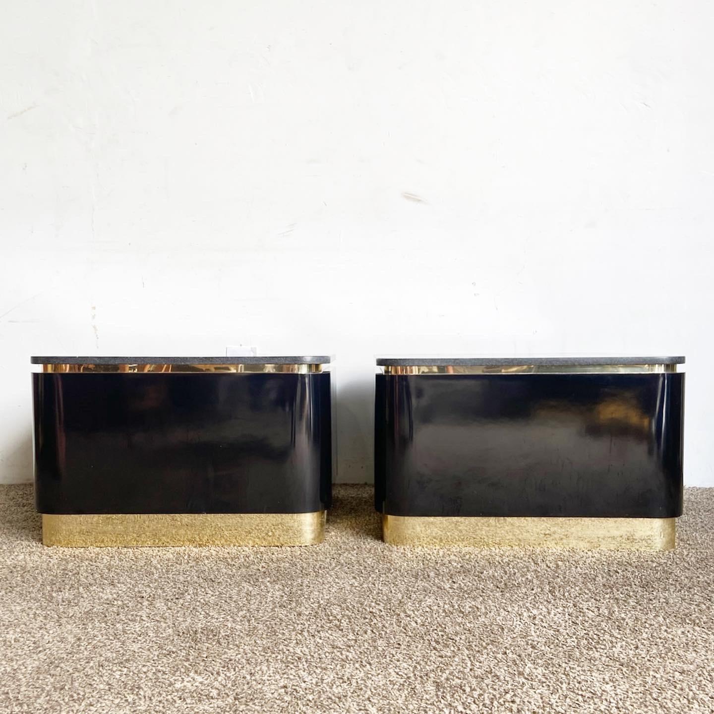 Elevate your living space with this exquisite pair of Postmodern Granite Gold Side Tables. Each table pairs a luxurious granite top with a black lacquer laminate base, and is accented with gold trim, combining functionality with dramatic, lavish