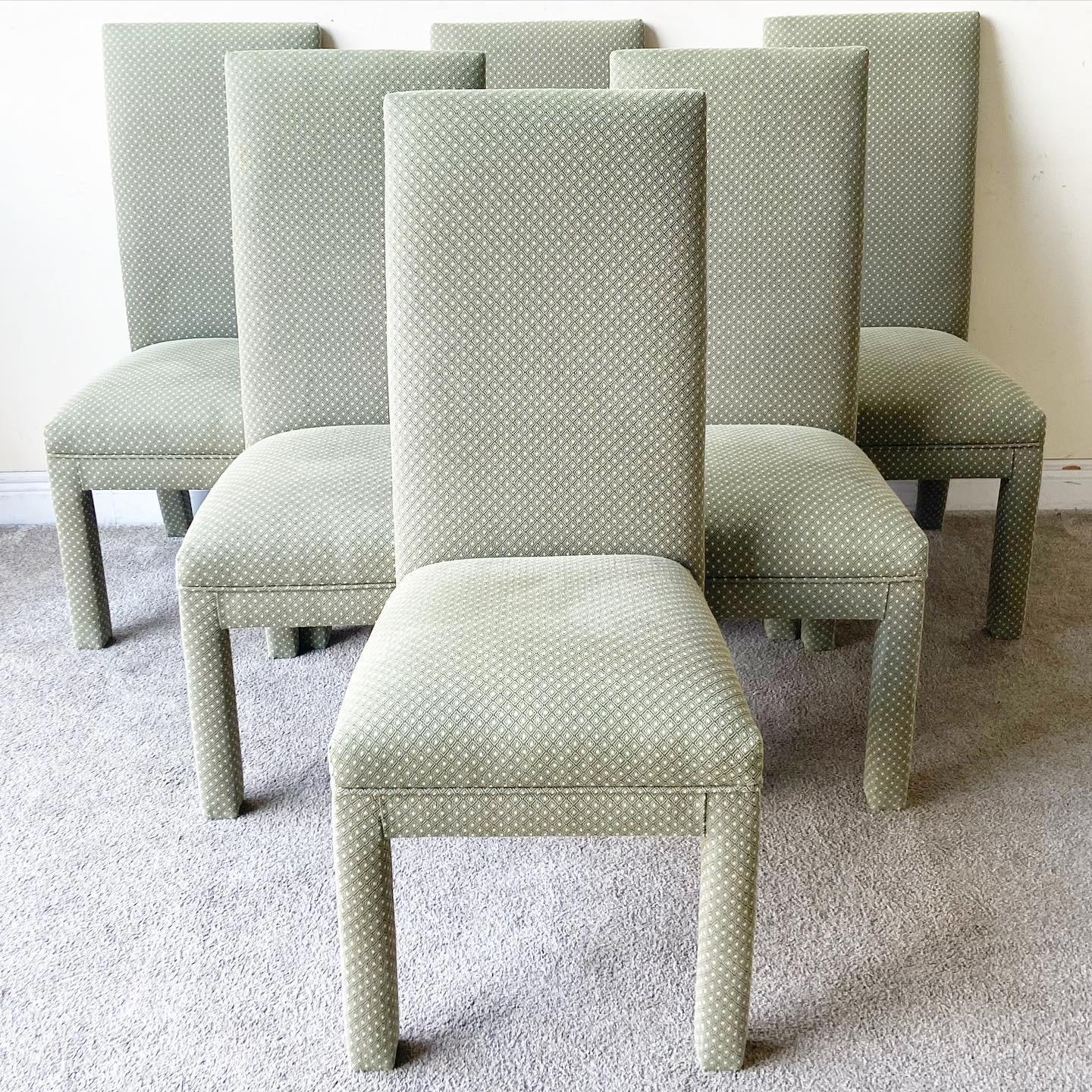 Exceptional set of postmodern parsons chairs. Features a green fabric with beige informally distributed through the fabric.
 