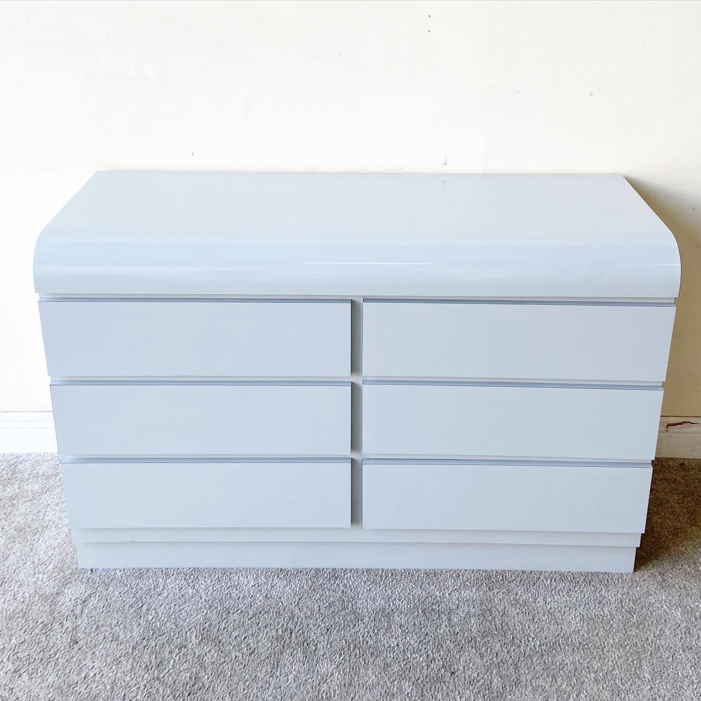 Amazing postmodern waterfall lowboy Dresser. Feature a grey lacquer laminate with 6 spacious drawers.

Additional information:
Materials: Wood
Color: Gray
Style: Postmodern
Time Period: 1980s
Place of Origin: USA
Dimensions: 47.25ʺ W × 17.5ʺ D ×