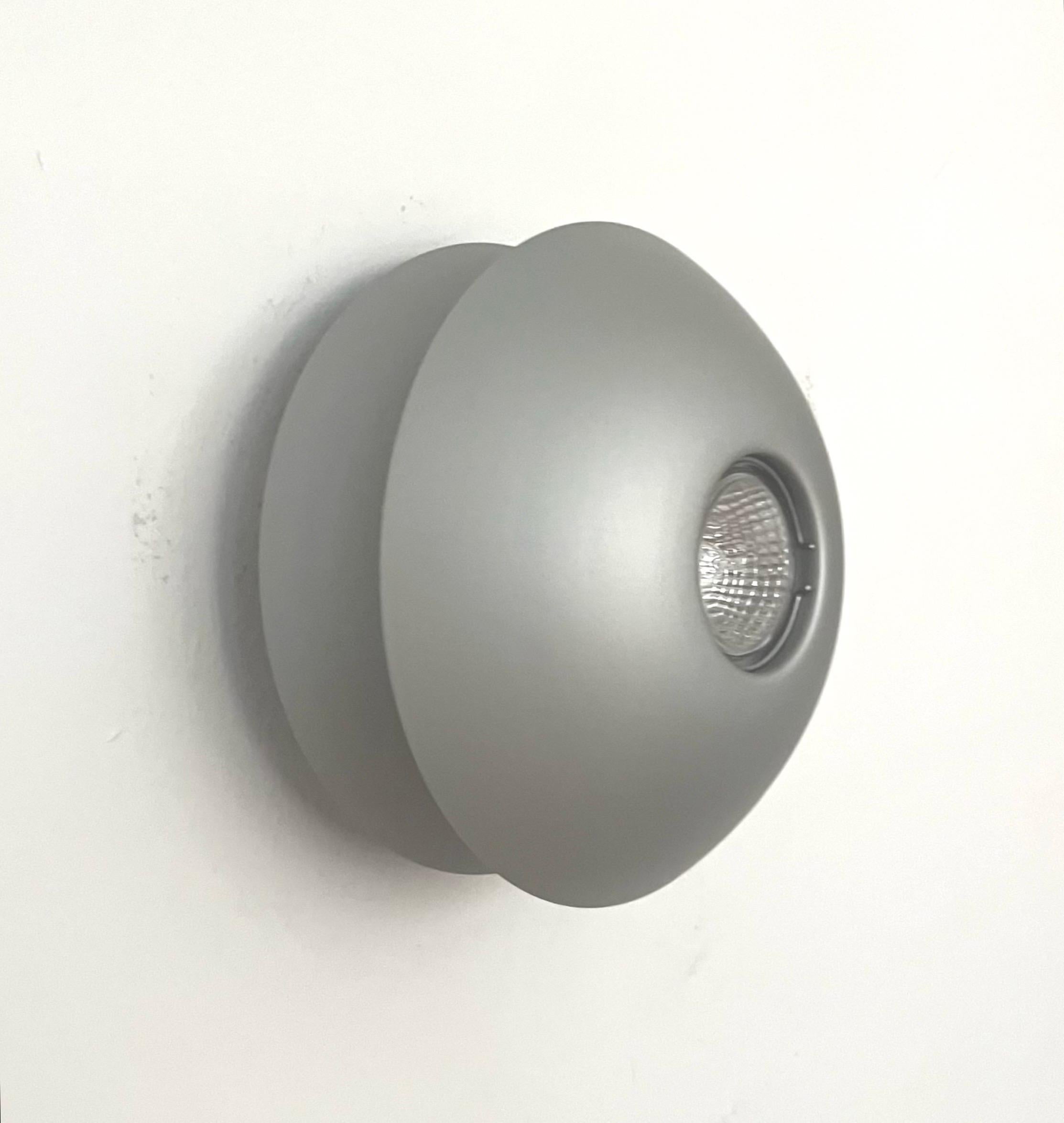 Pretty Postmodern Spanish Halogen Pair of grey metal Wall Sconces or Flush Mounts by Blauet. Model: Birimbao-2. These fixtures were designed and manufactured in Barcelona (Spain) by Blauet during 1980s.
They have never been used, the condition is