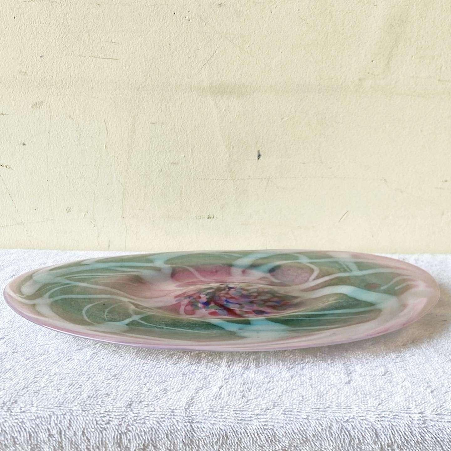 Amazing vintage postmodern hand blown glass platter. Features a pink and green with swirling and dots.
