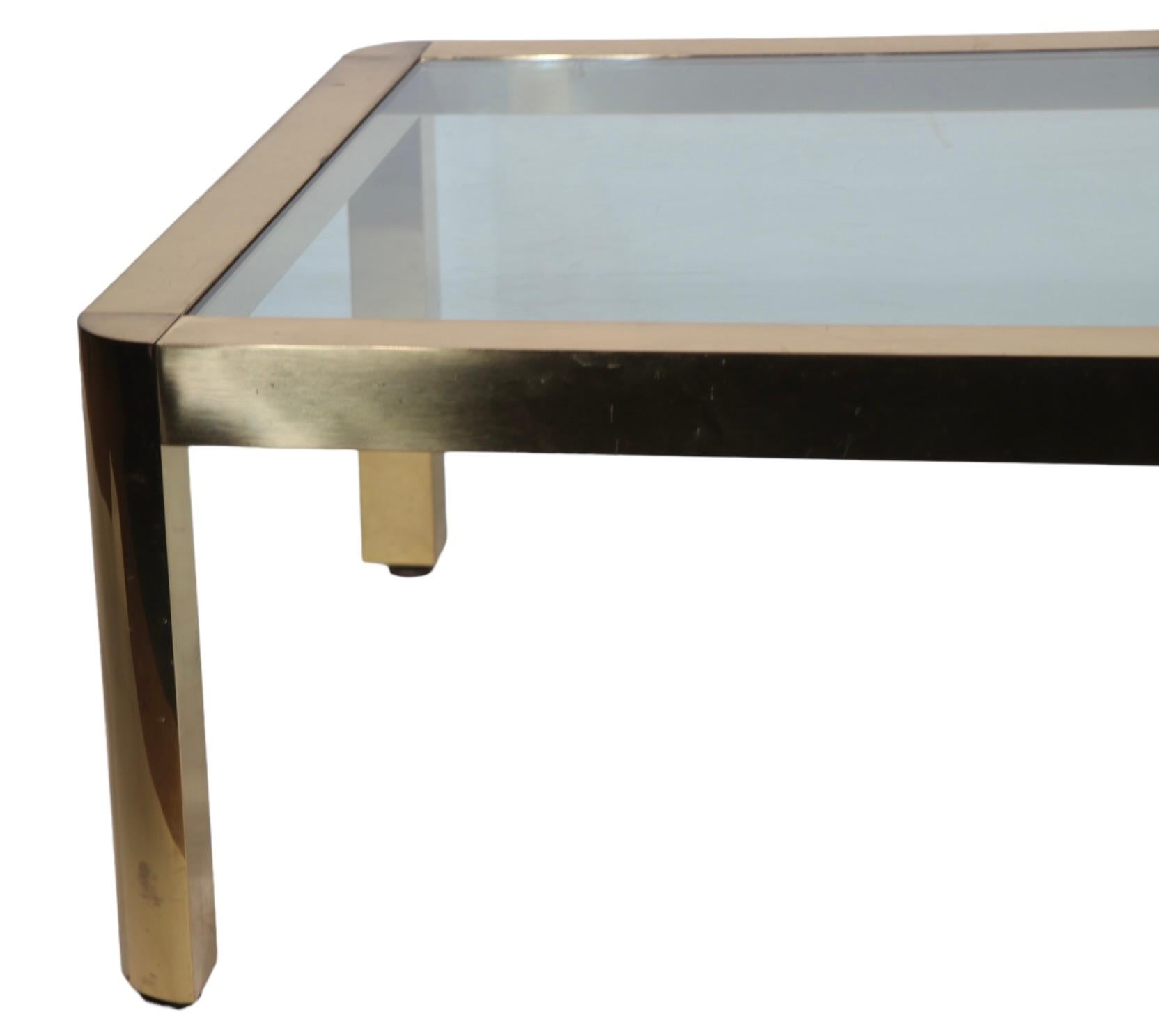 Postmodern Hollywood Regency Brass and Glass Coffee Table Made in Italy c 1970's In Good Condition For Sale In New York, NY