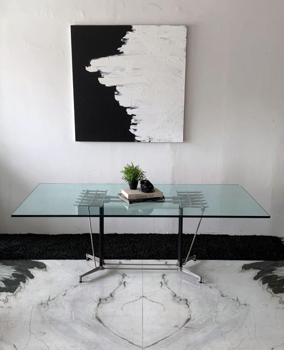 This dining table is equal parts post modern and industrial modern and just oozes California modernism. This dining table or writing desk was designed by Robert Josten in the 1970's. Made of aluminum, this metal grille / grid style is a staple of