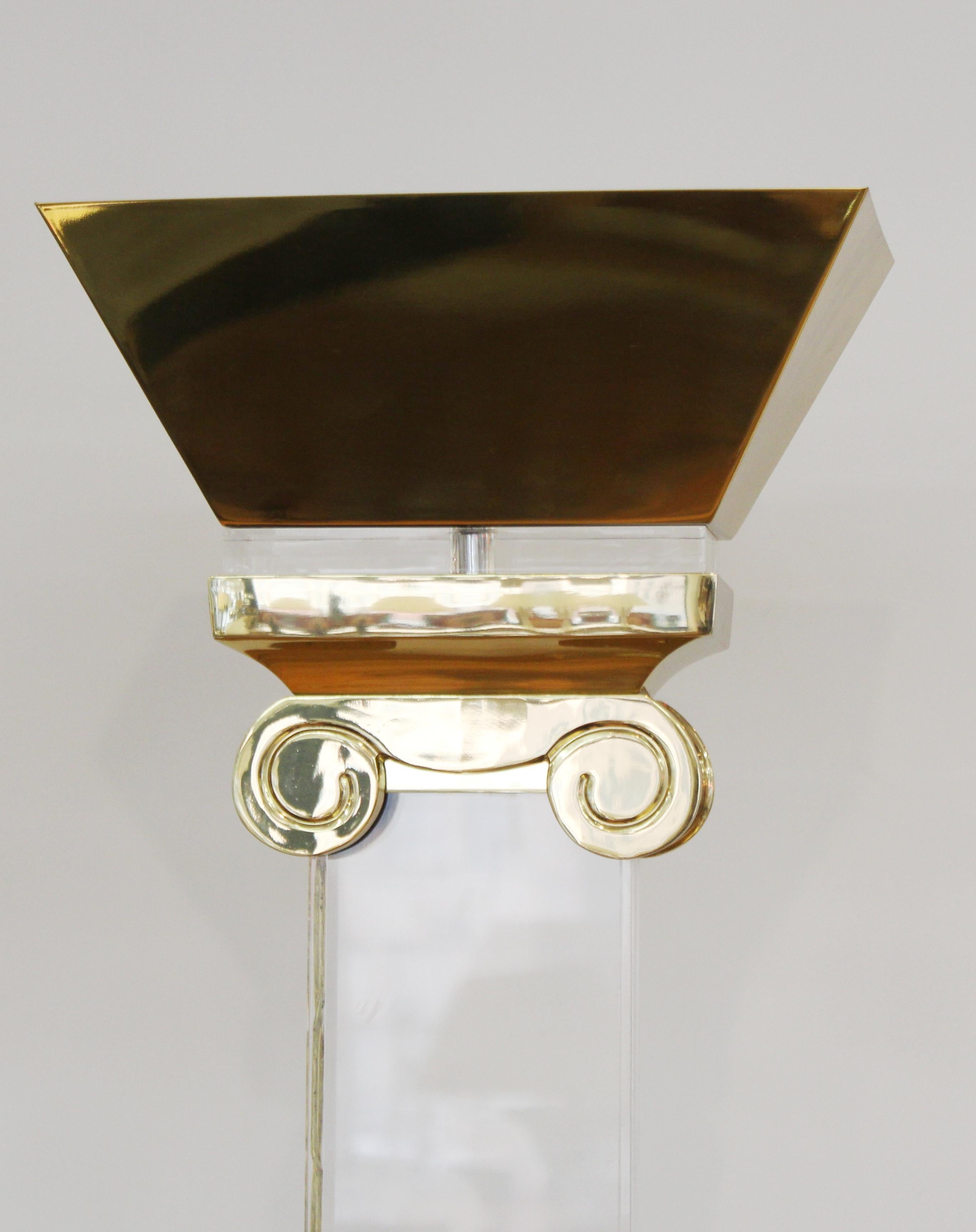 Postmodern ionic column shaped torchiere floor lamp with brass chapter and base and Lucite column.
