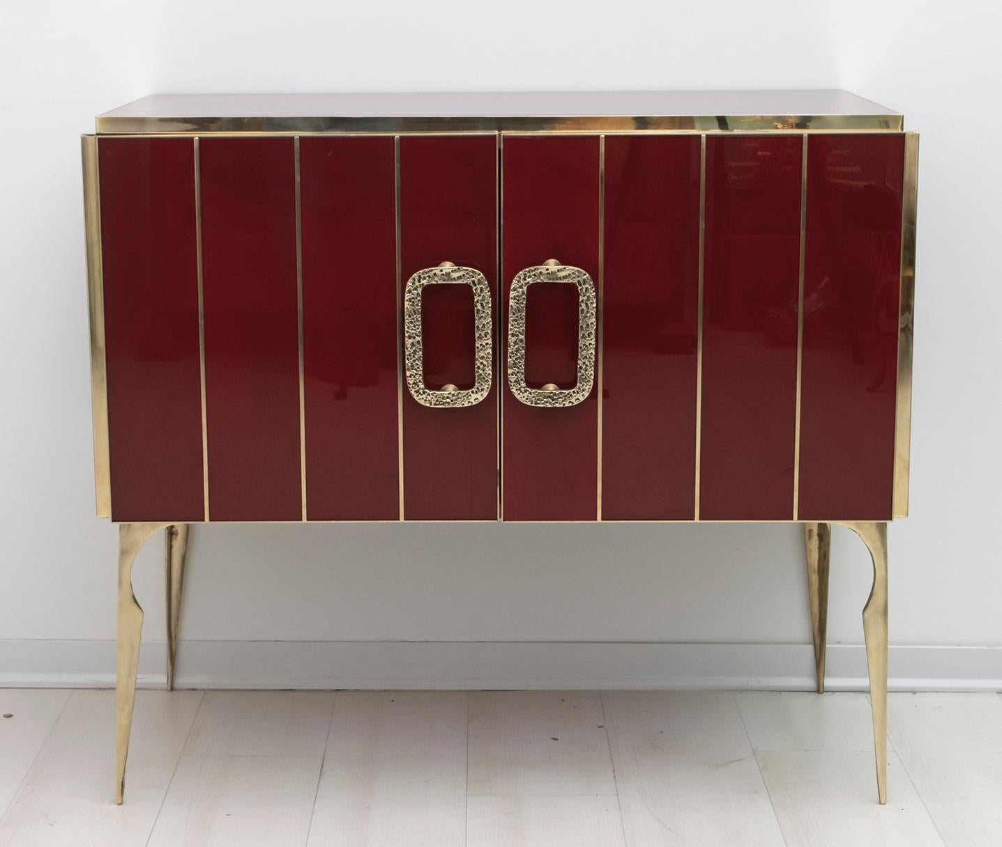 Beautiful Italian sideboard or bar cabinet made of burgundy red glass and brass, wooden structure.