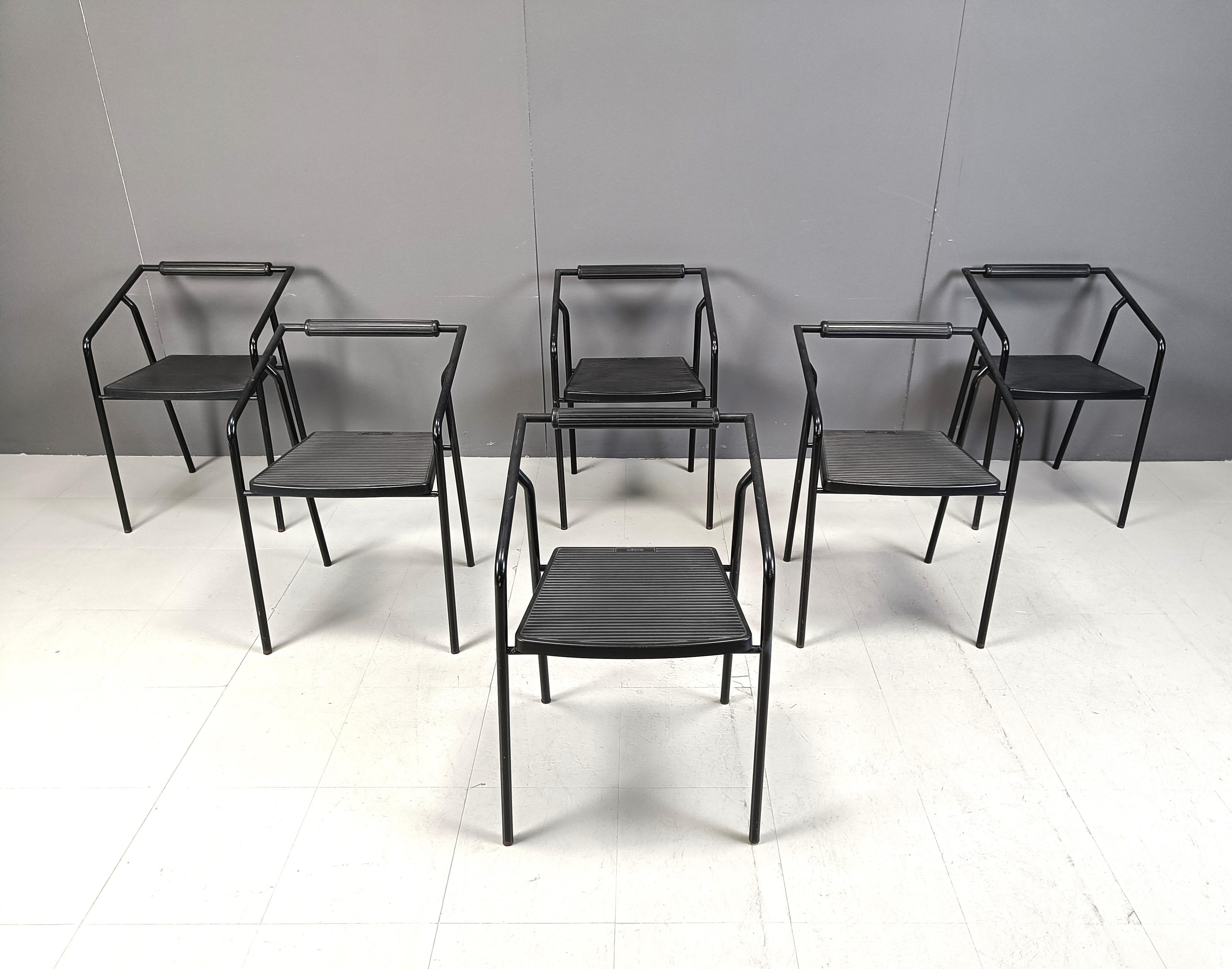 Vintage post modern stackable  dining chairs labelled with Lexis 'System' - an italian furniture manufacturer.

Cool minimalist/post modern design with black metal frames and black foam sets.

1990s - Italy

Dimensions:
Height: 72cm
Width: