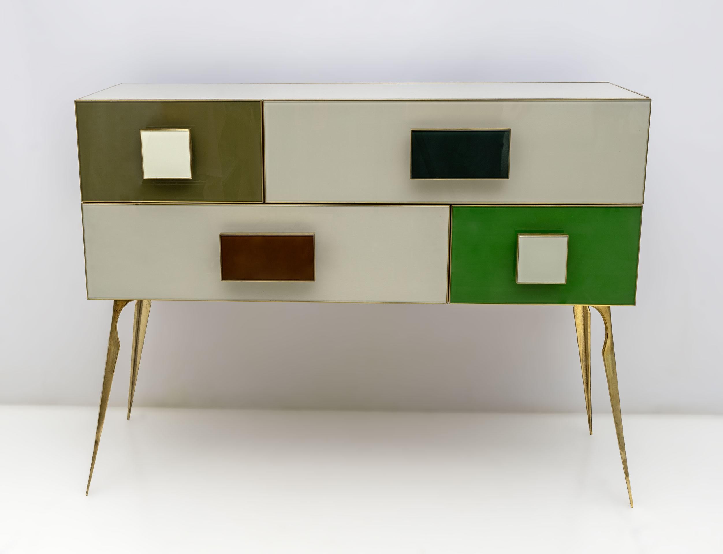 An interesting colorful postmodern piece with a Pop Art twist, very fun Italian chest of drawers or dresser, 4 drawer front design in ivory and green, as well as rectangular Bordox glass handles and light green and dark green, which highlight the