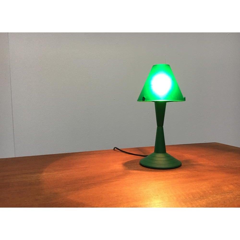 Small table lights from Veneta Lumi.

The Lulu combines the classic luminaire shape with contemporary materiality. It is made of colored plastic. This piece has an attribution mark, It is completely authentic for any authenticity issues arising from