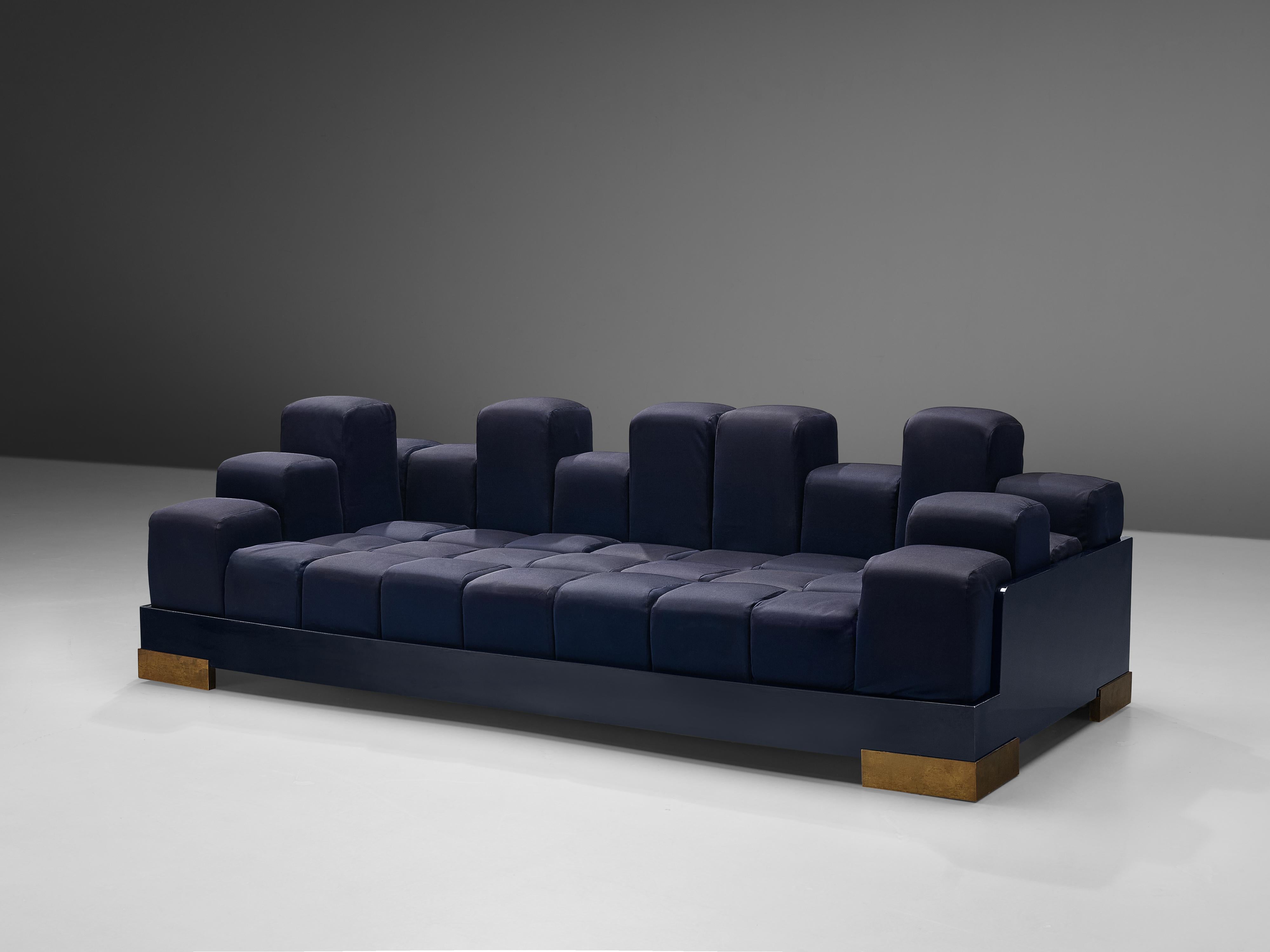 Modular sofa, blue upholstery, wood, brass, Italy, 1980s

Rare Italian sofa consisting of multiple cubes in a wooden frame. Both the seat and the surrounding frame are built of multiple cubes. A playful detail is the fact that he surrounding
